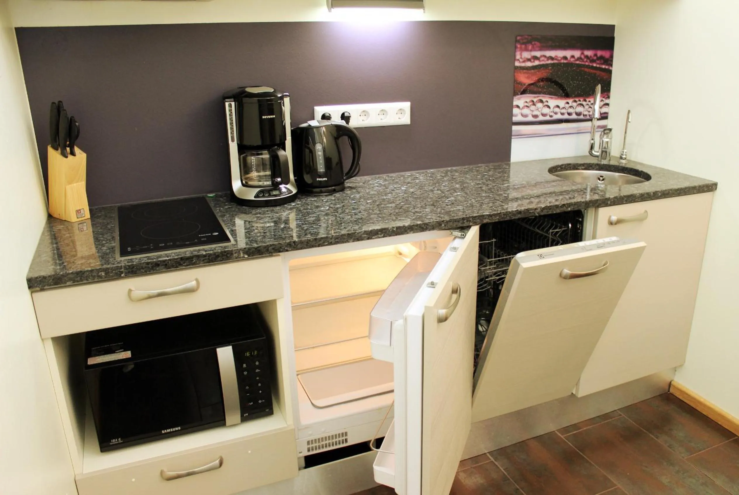 Kitchen or kitchenette in Embrace Hotel & Apartments