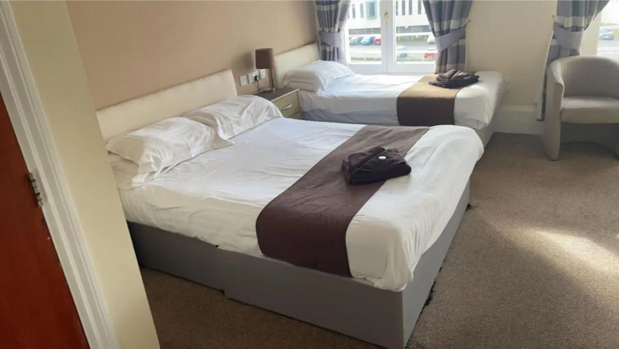 Bed in Royal Grosvenor Hotel