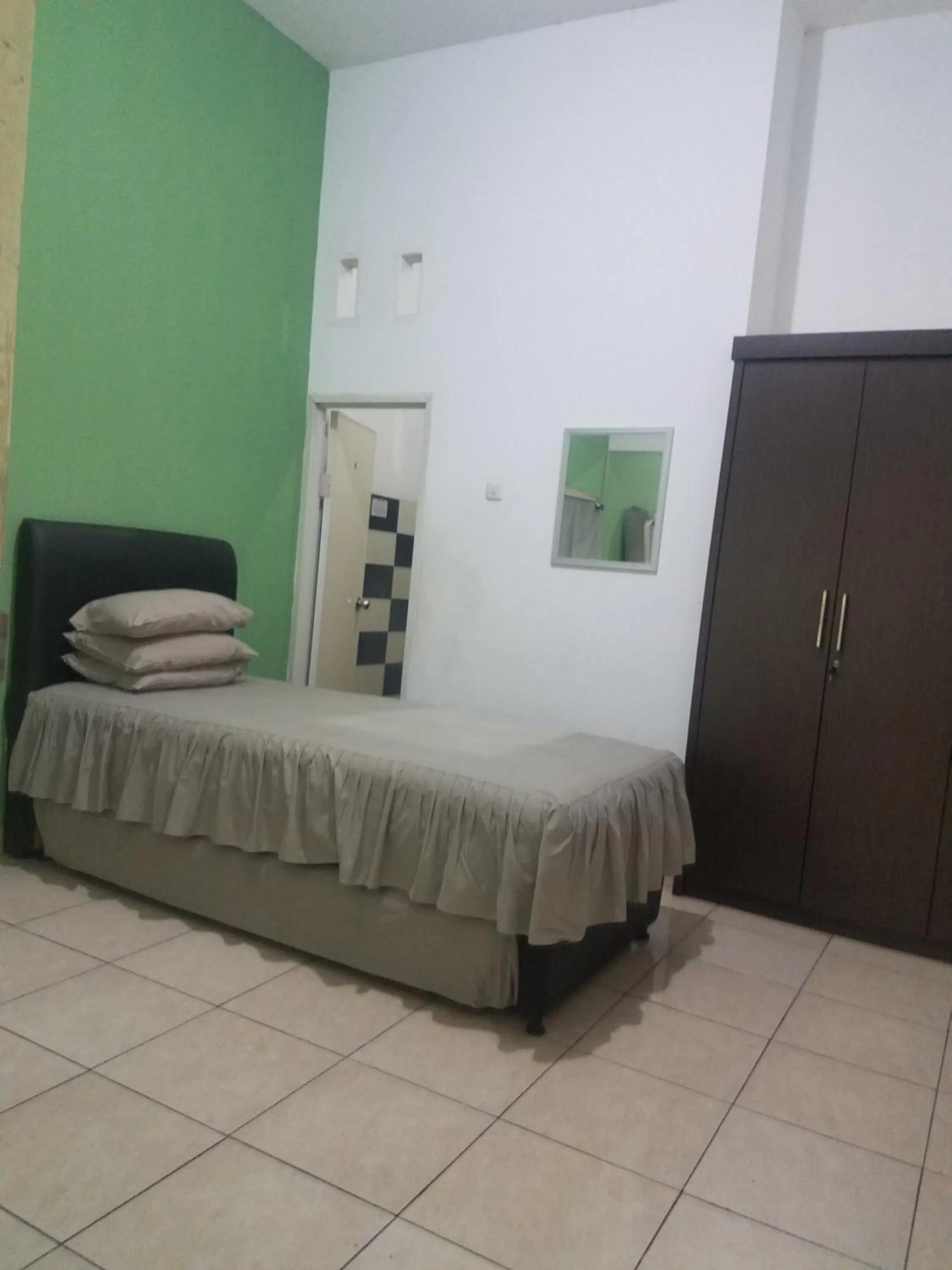 Bed in Cendrawasih Syariah Homestay