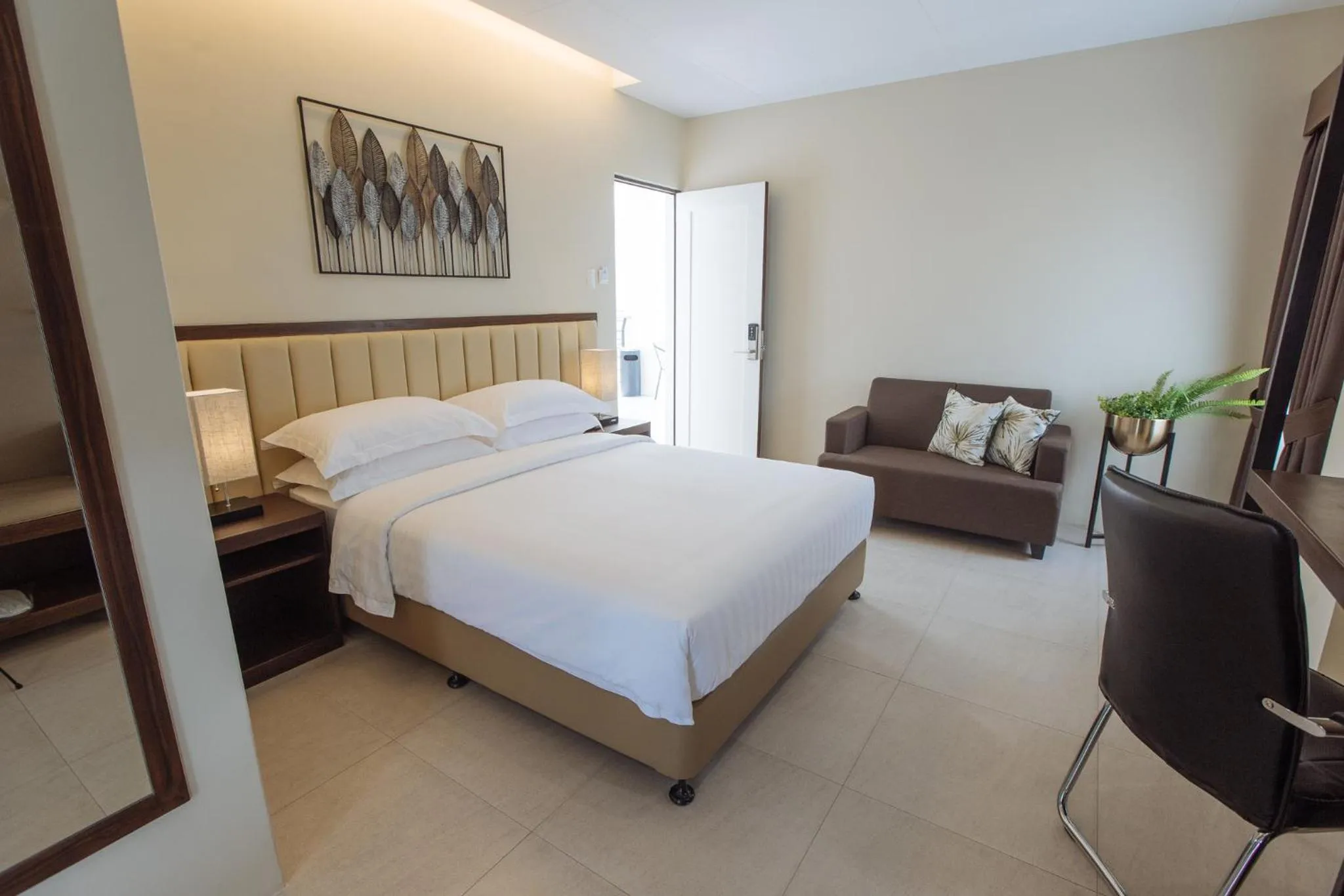 Bed in Rovira Suites