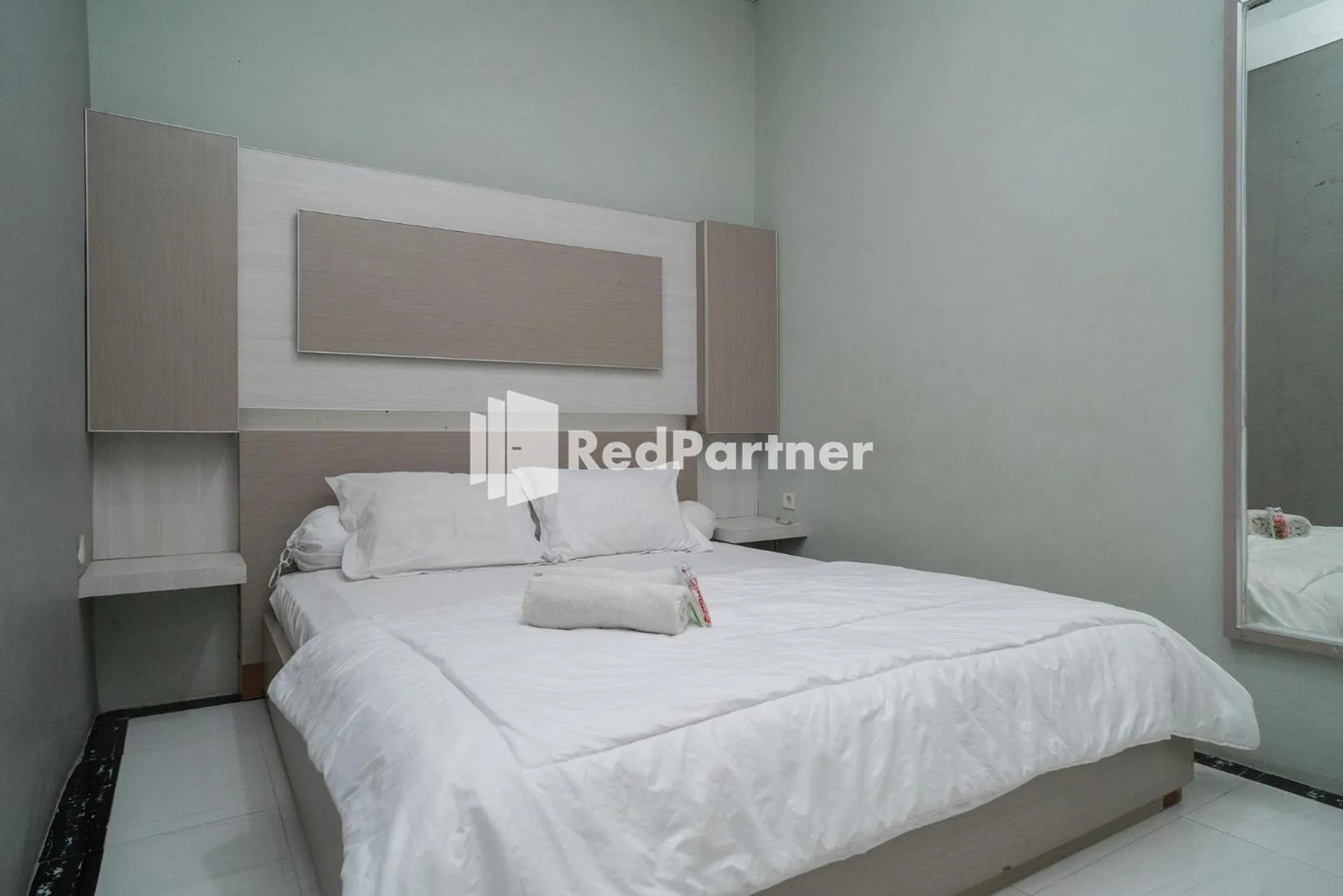 Bed in Yayah Rooms Bogor Syariah Mitra RedDoorz