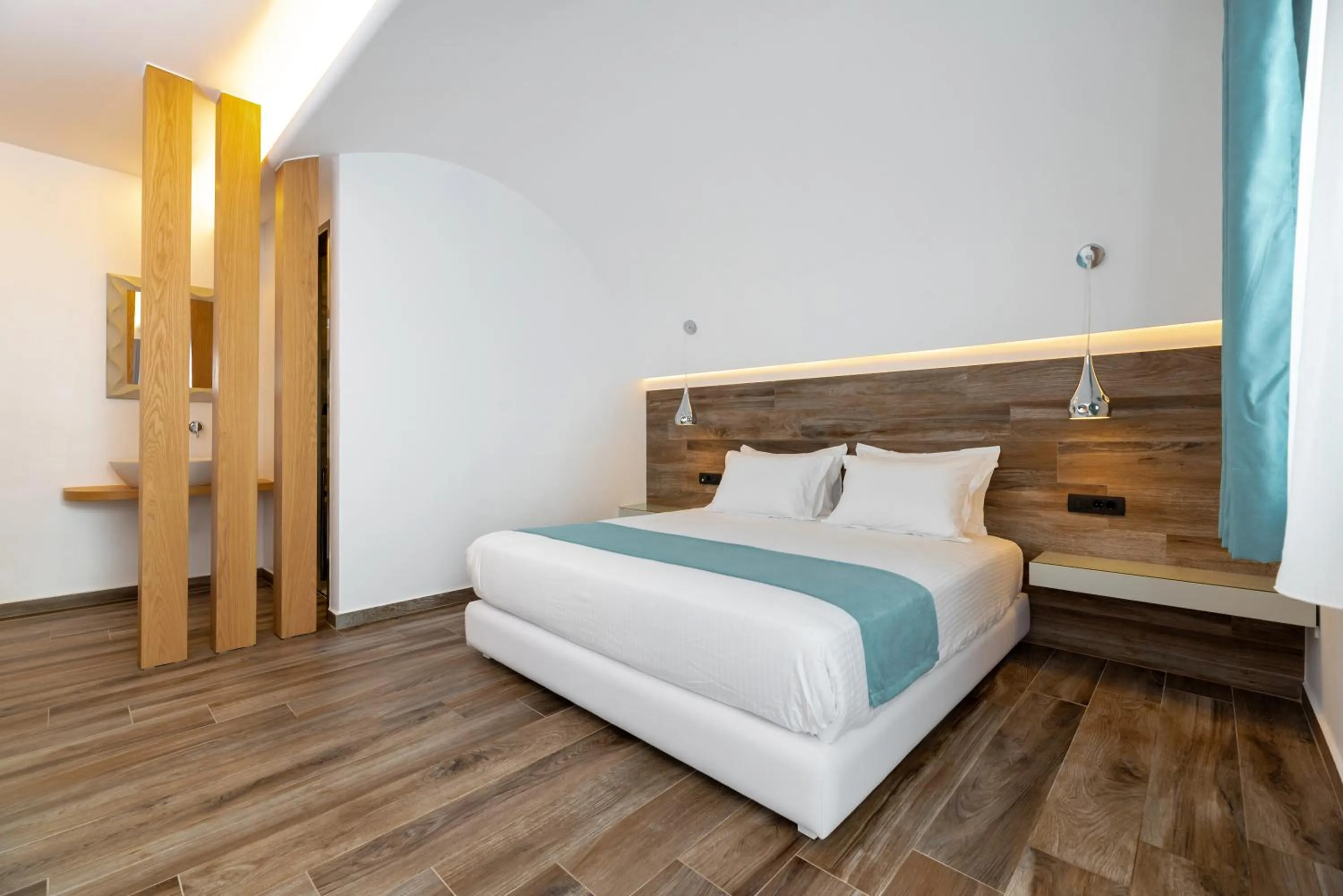 Bedroom, Bed in Deluxe Suites Santorini