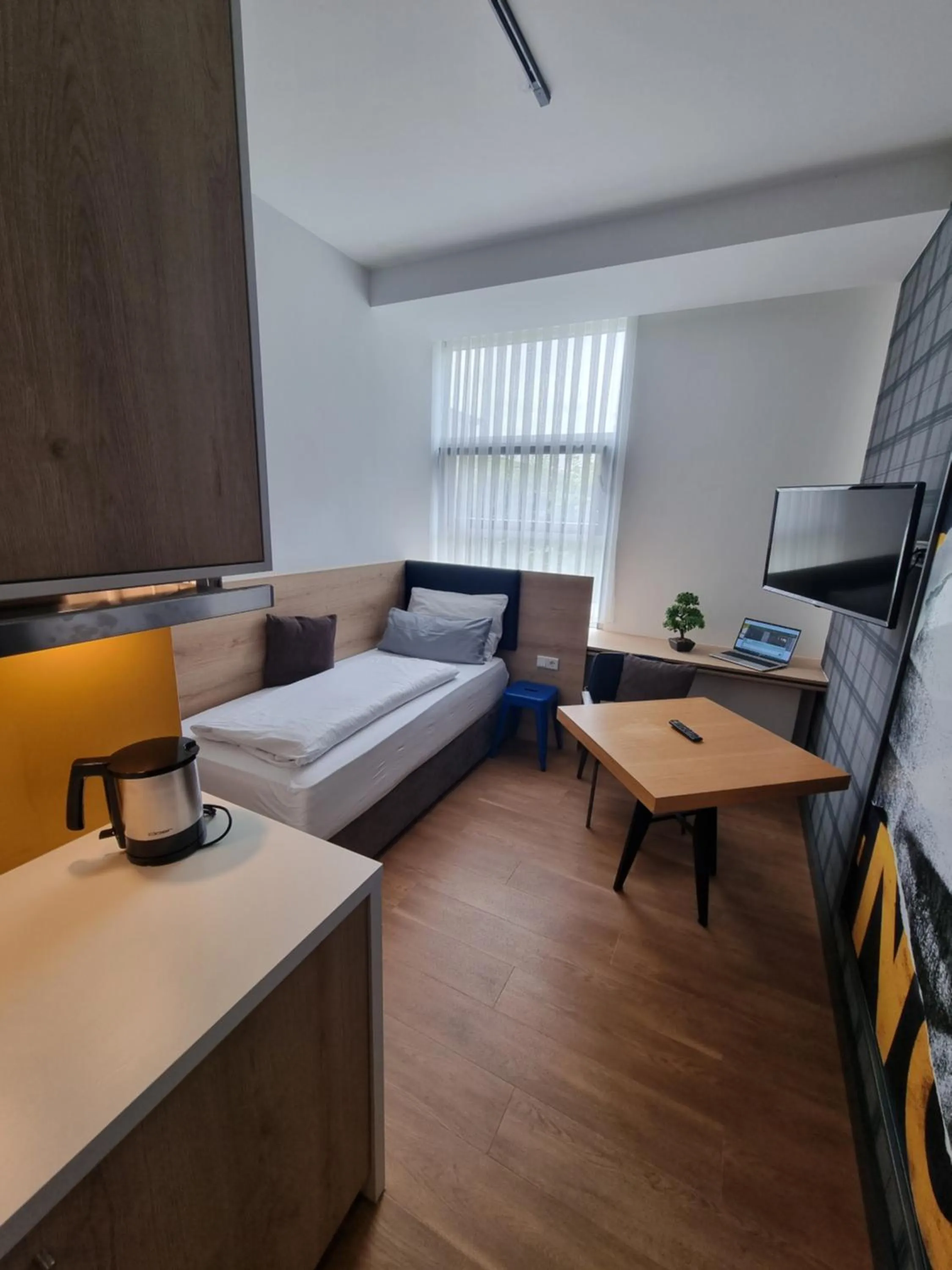 Kitchen or kitchenette, Bed in my MINGA Airport serviced Apartments