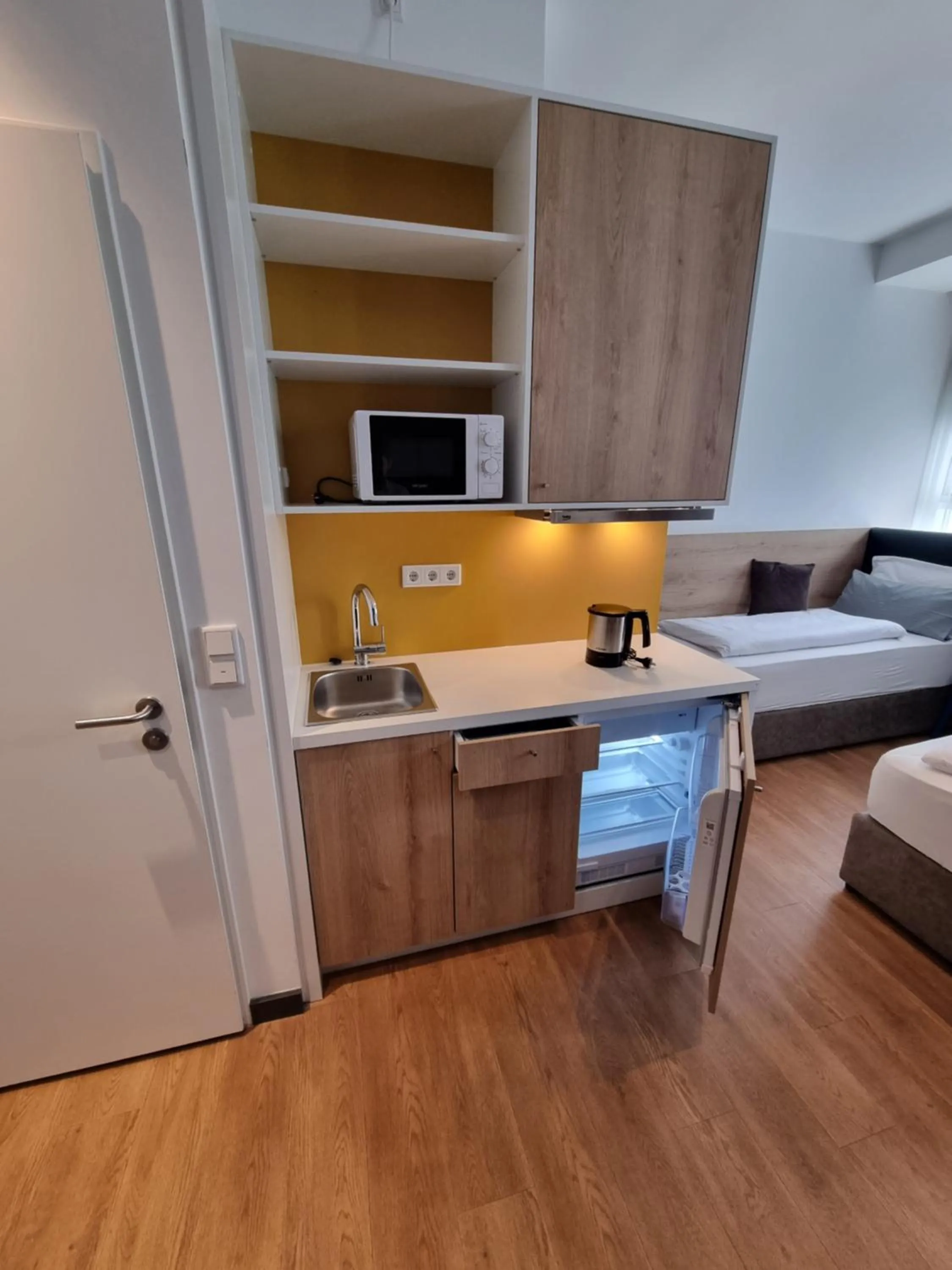 Kitchen or kitchenette in my MINGA Airport serviced Apartments