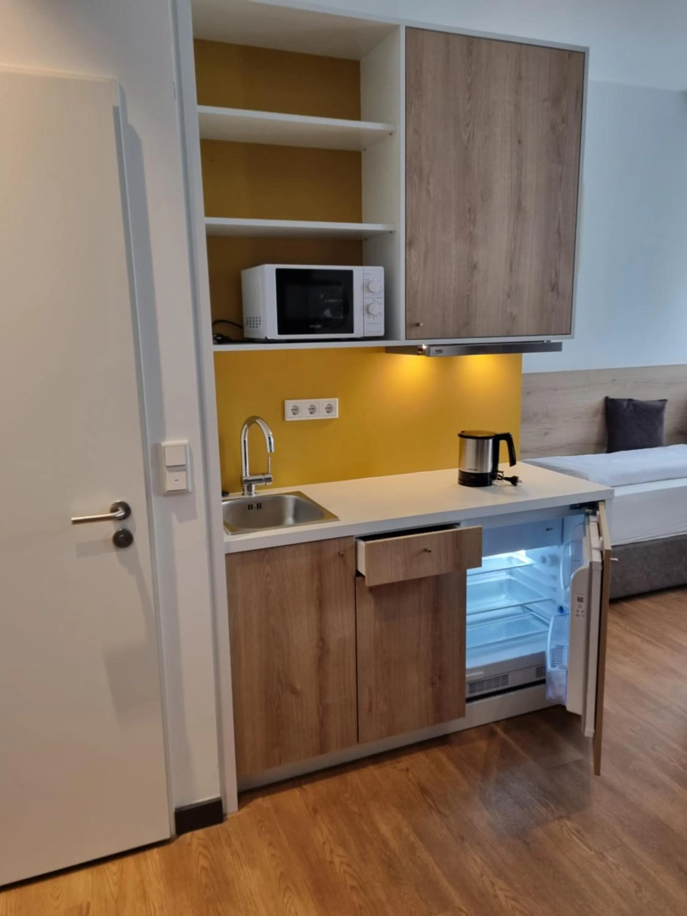 Kitchen or kitchenette in my MINGA Airport serviced Apartments