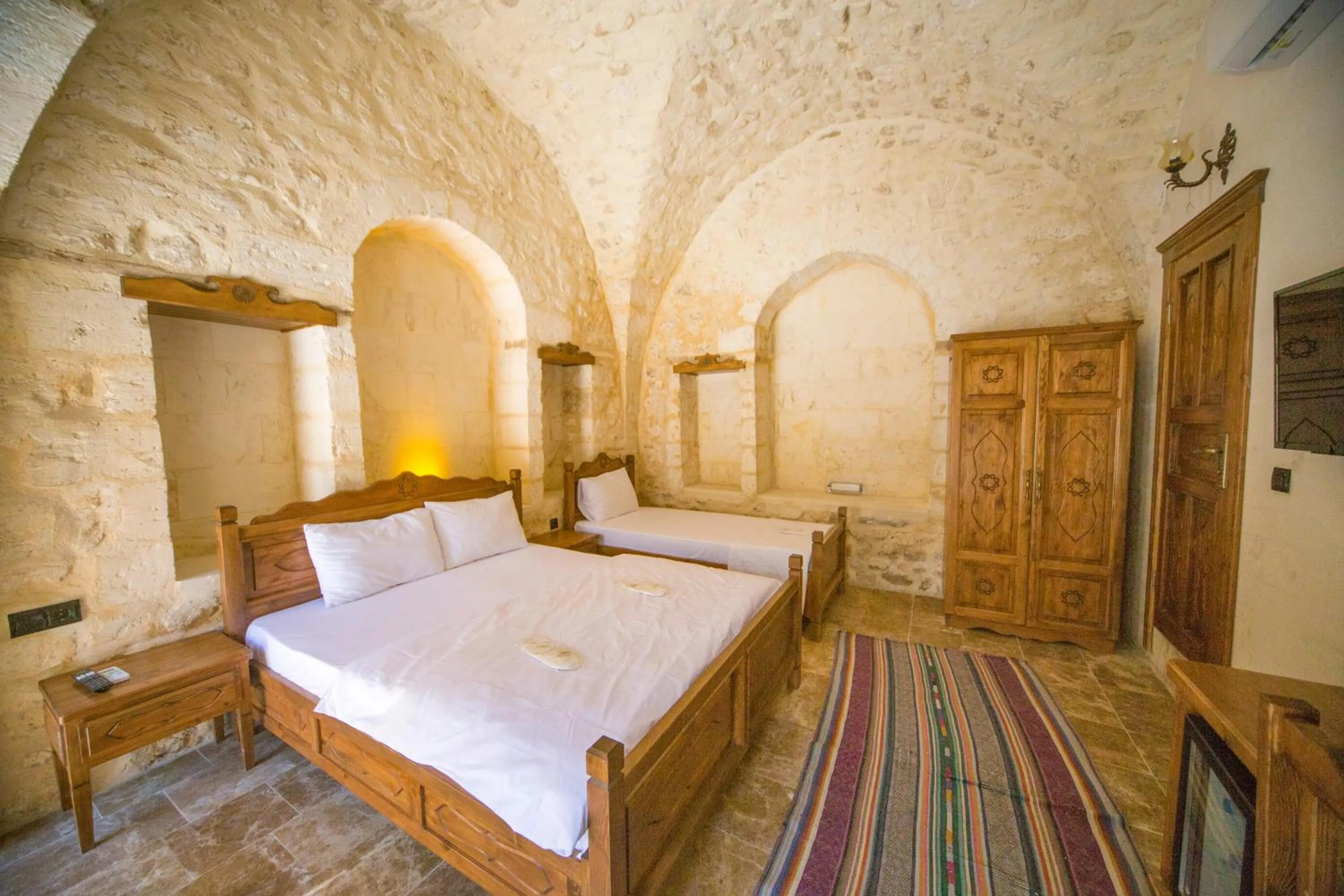 Bed in PALMYRA BOUTIQUE HOTEL