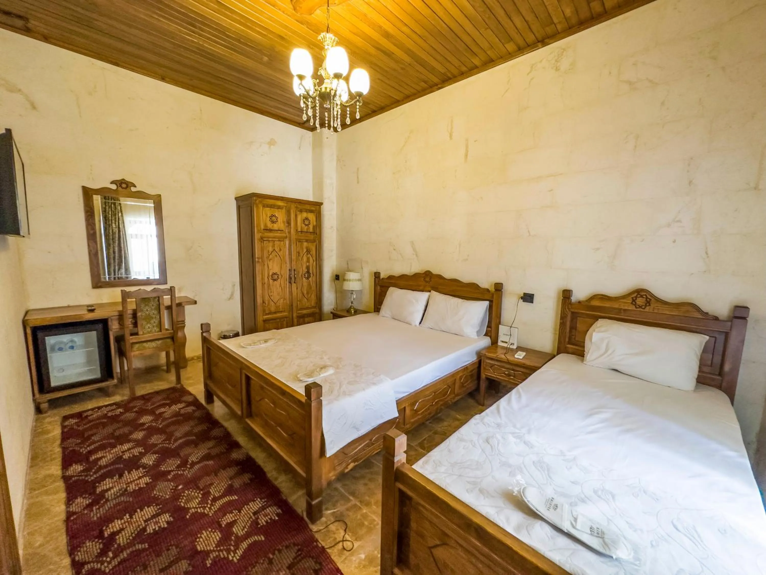 Bed in PALMYRA BOUTIQUE HOTEL