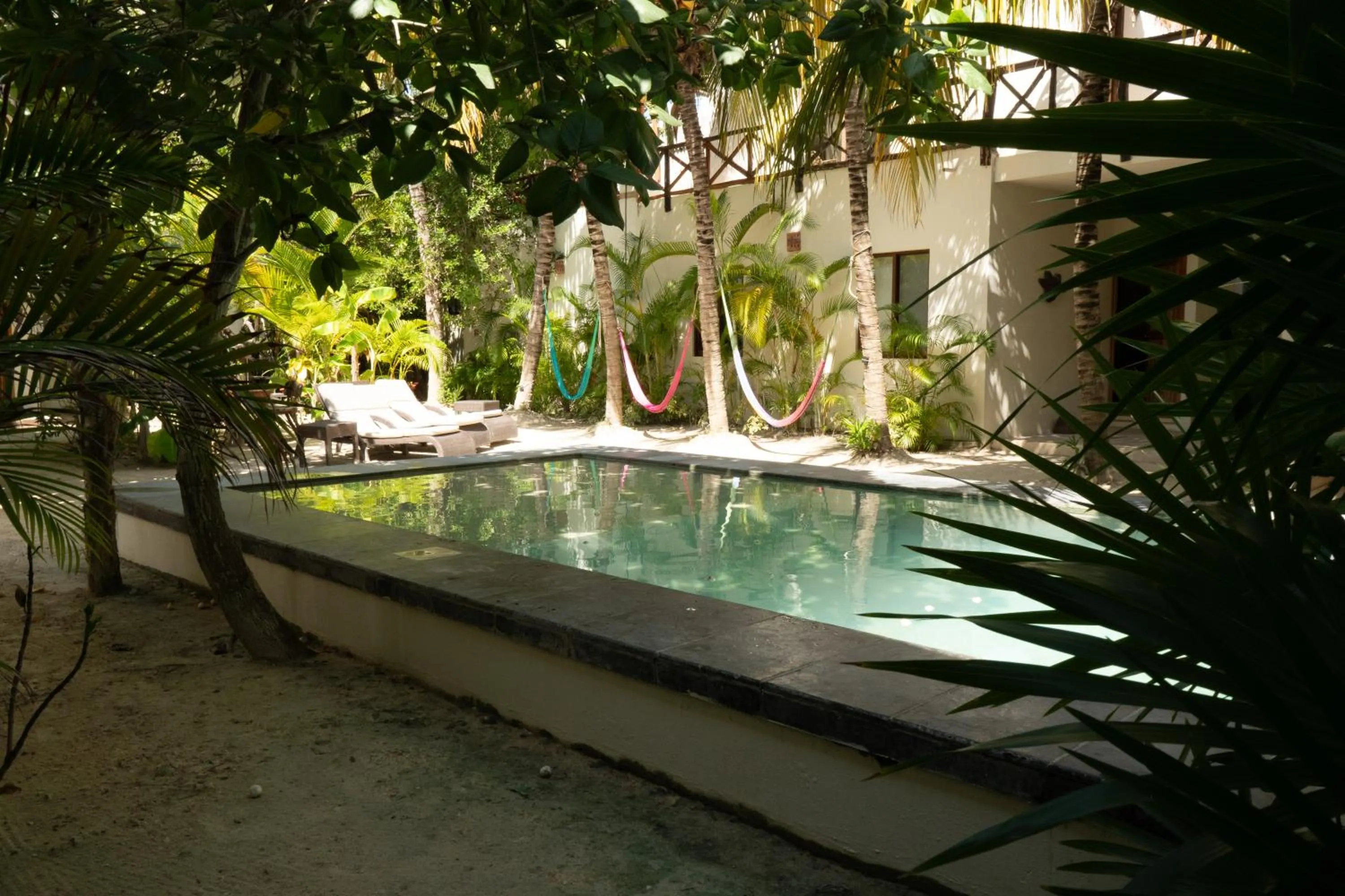 Swimming pool in Hotel Boutique La Puerta Azul Beachfront - Adults Only