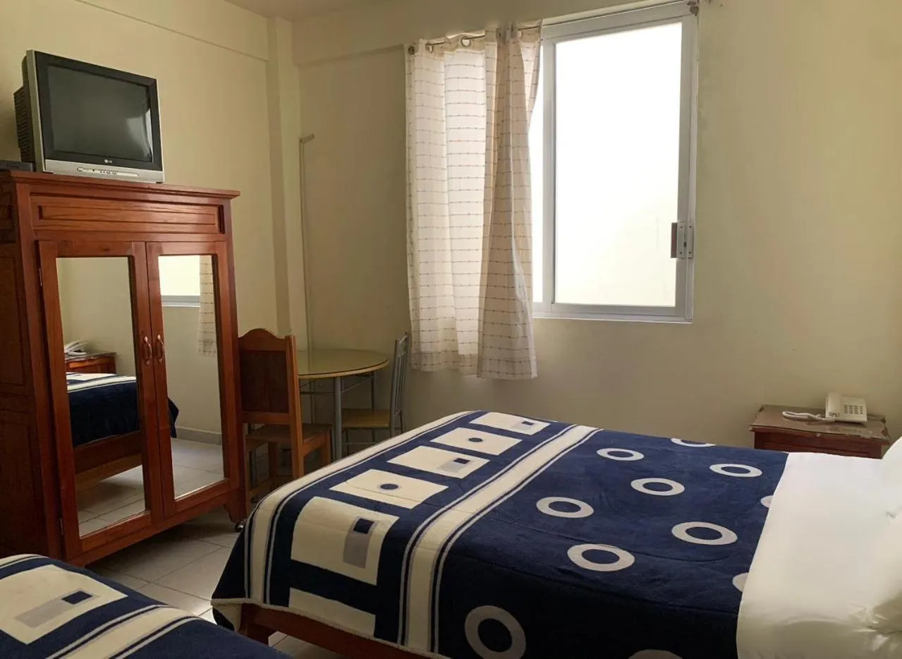 Bed in Hotel Renacimiento