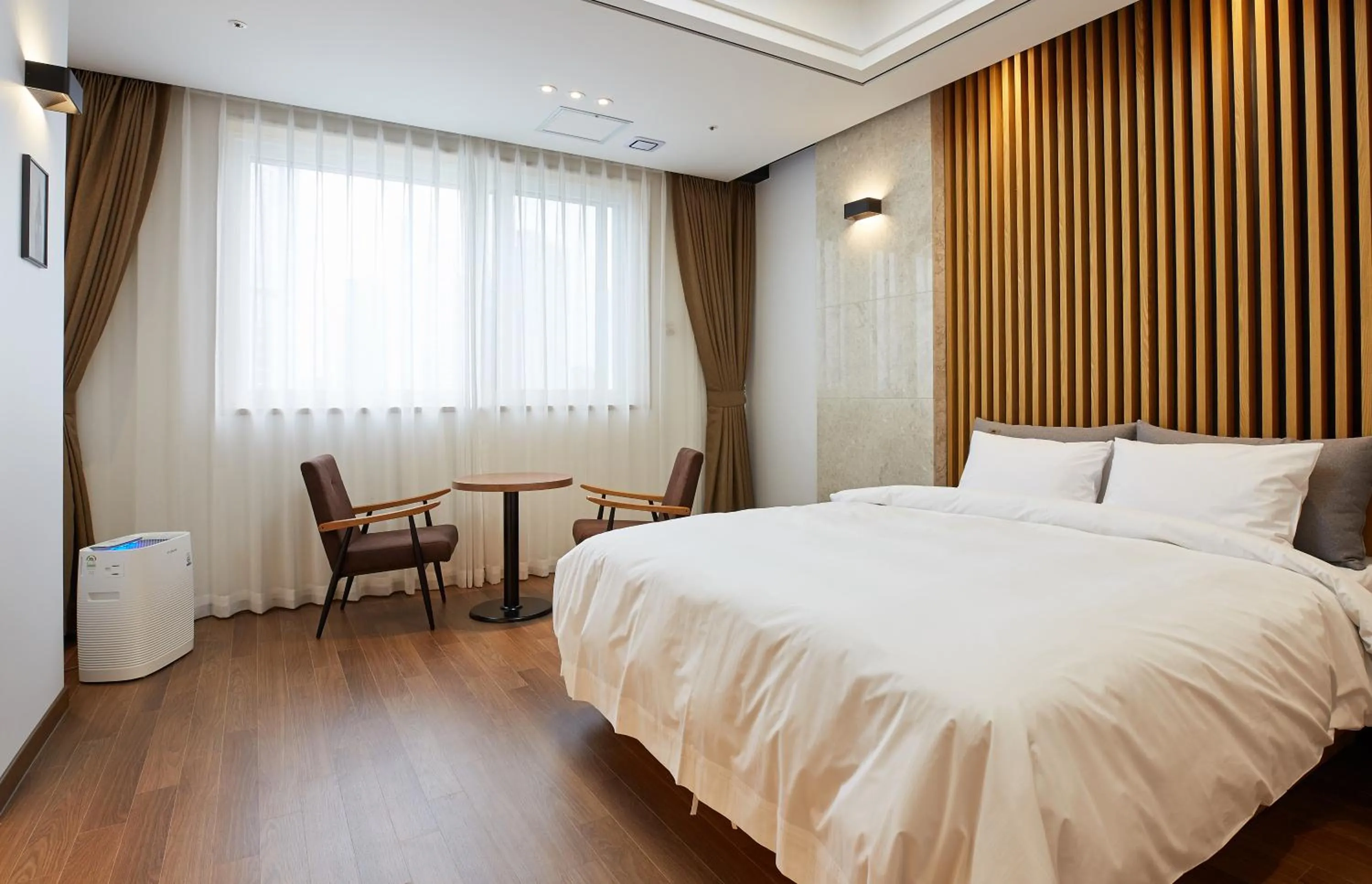 Bed in Noble Stay Hotel