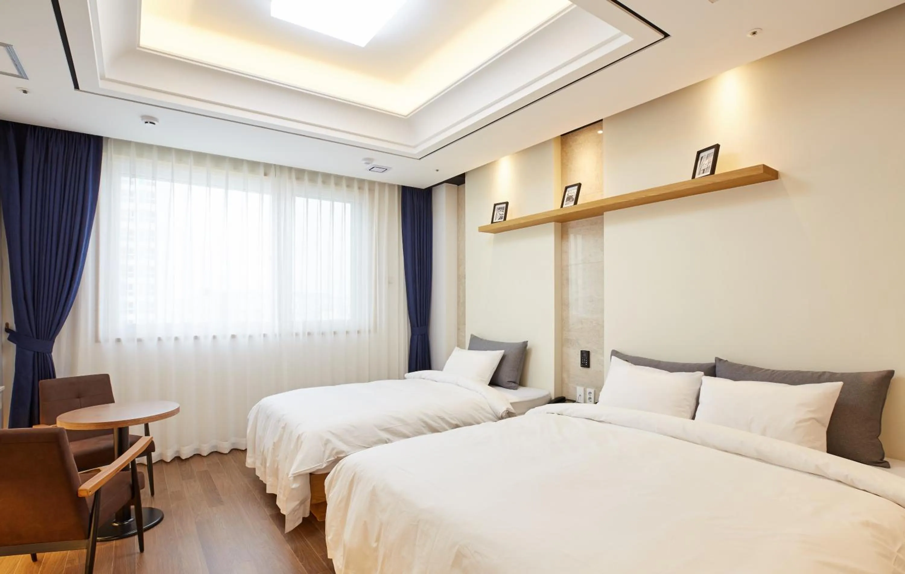 Bed in Noble Stay Hotel