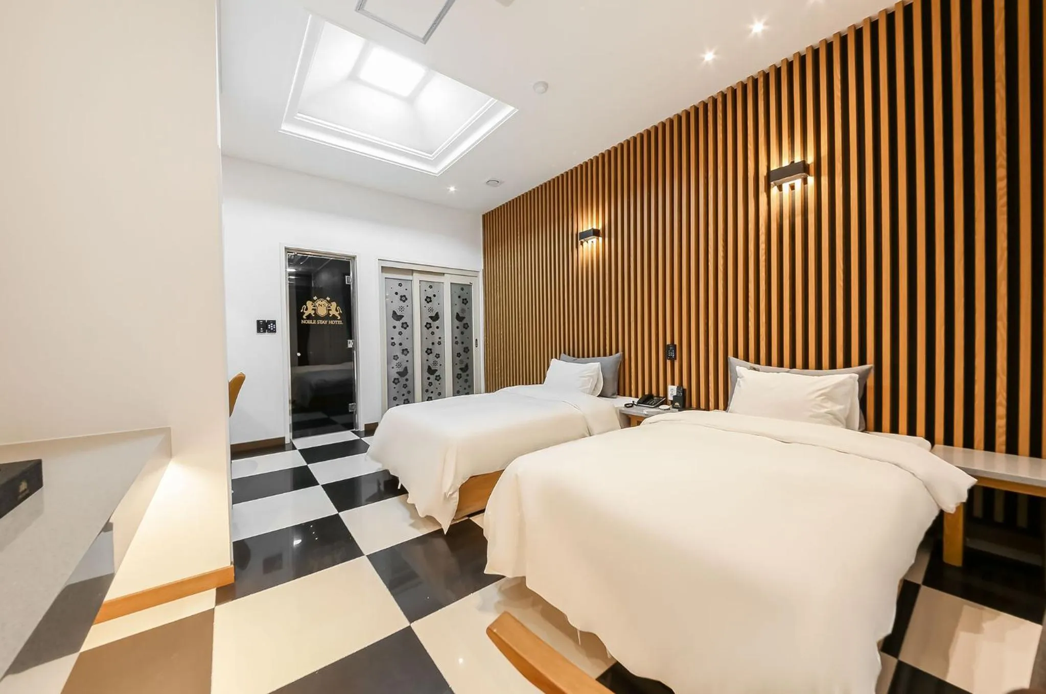 Bed in Noble Stay Hotel