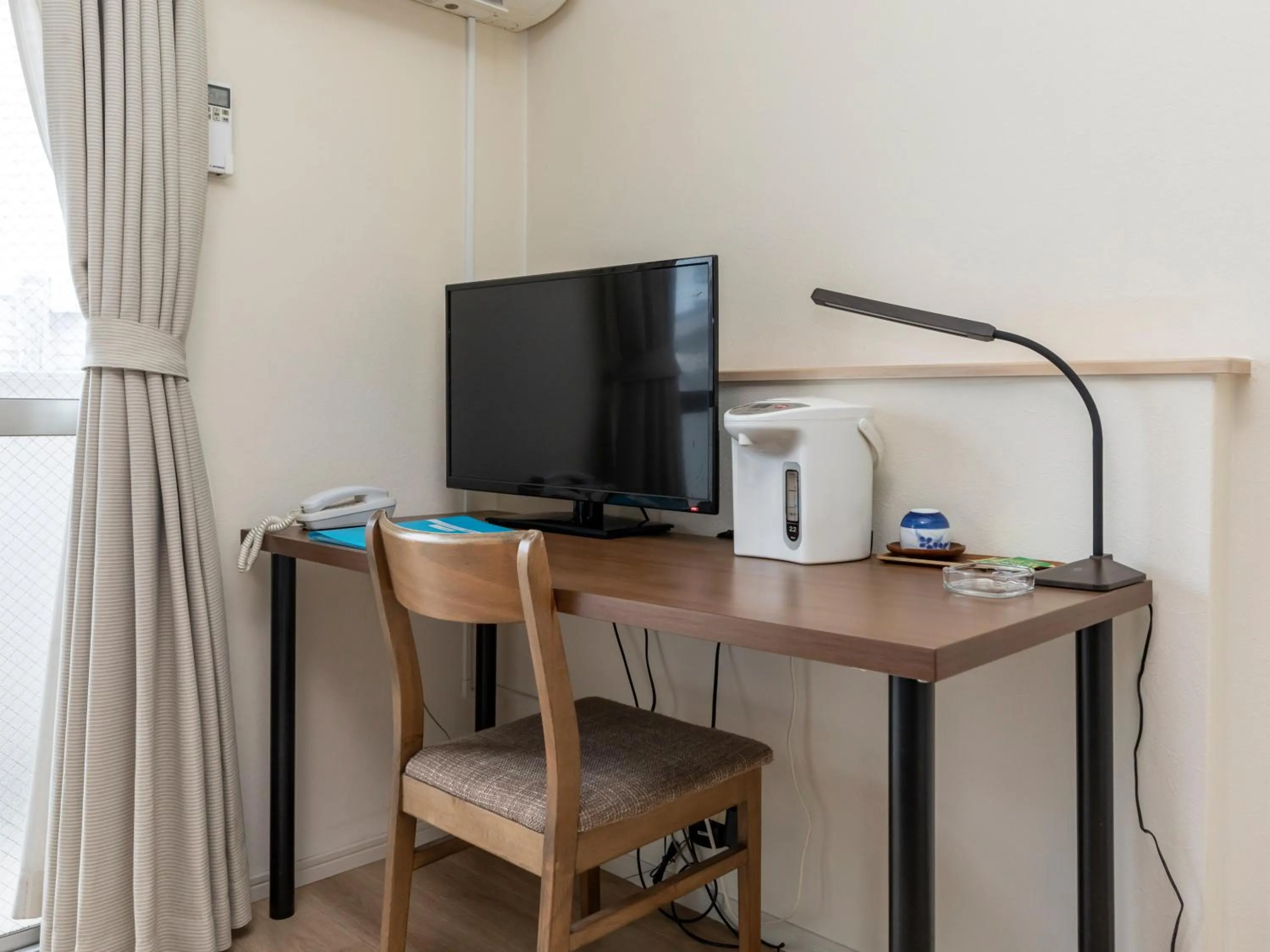 TV and multimedia in Tabist Motodai Business Hotel Kanonji