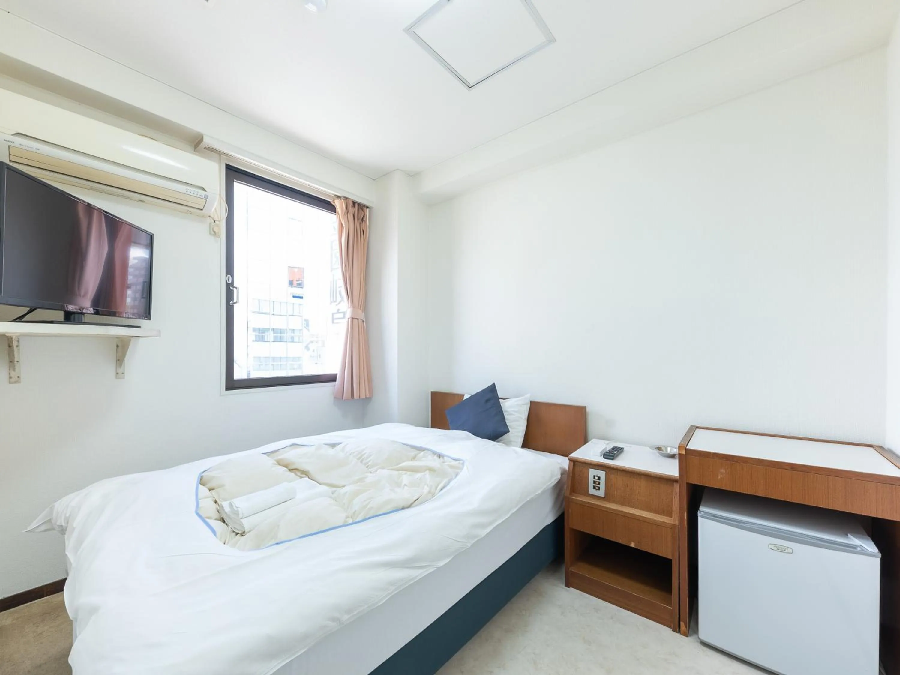 Bed in Tabist Business Hotel Kanazono Gifu