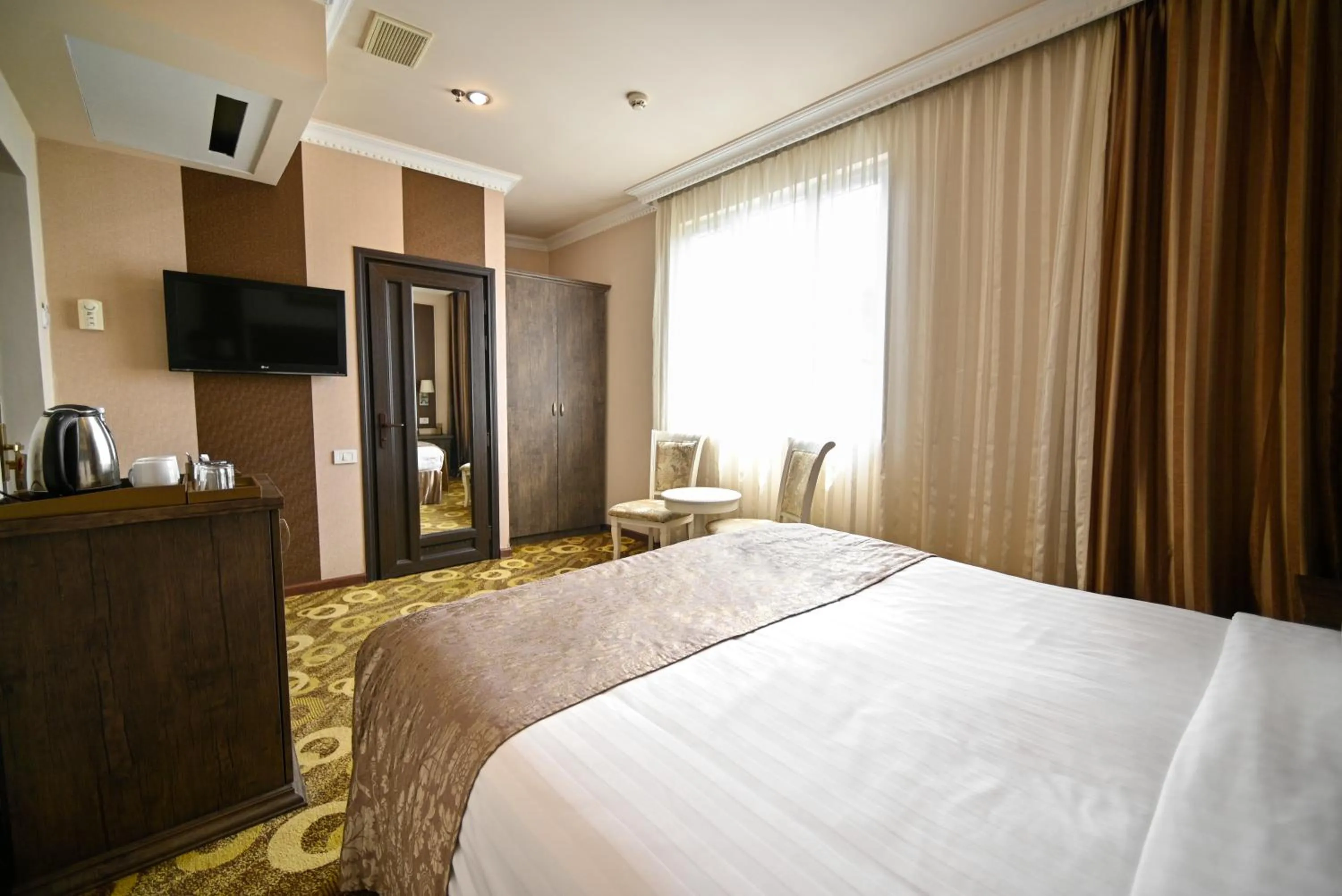 Bed in Imperial Palace Hotel Yerevan