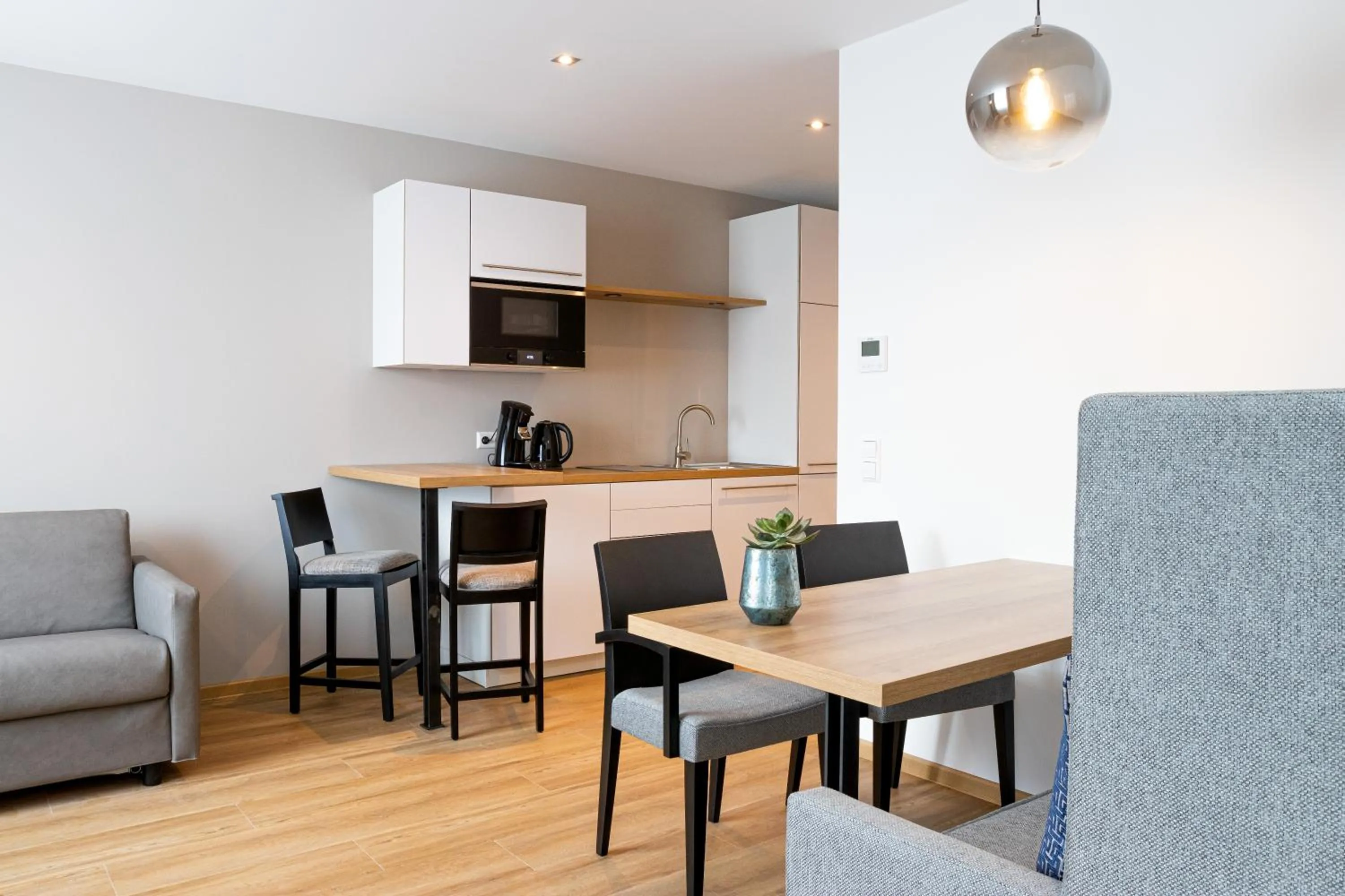 Kitchen or kitchenette in bodenseezeit Apartmenthotel Garni