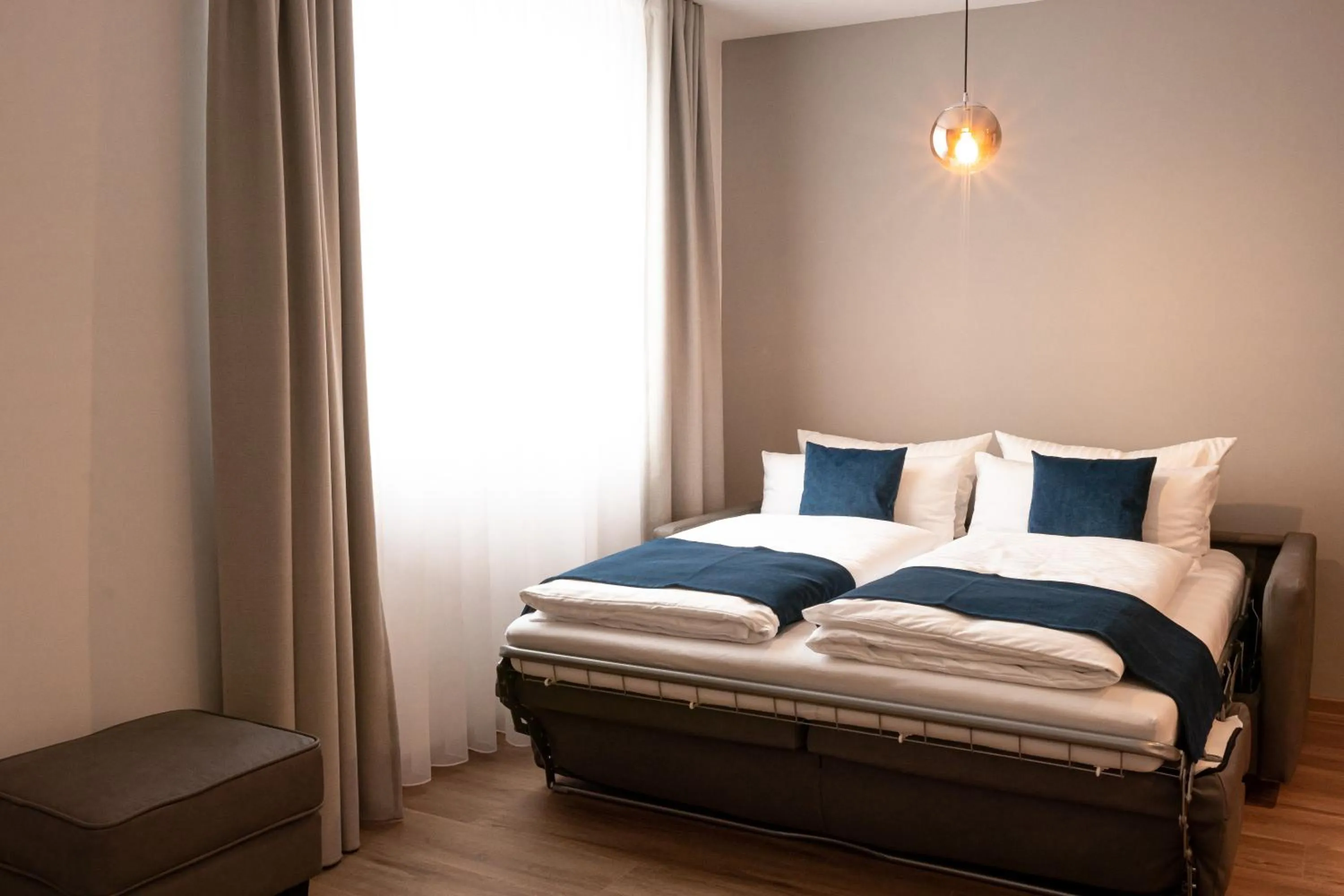 Bed in bodenseezeit Apartmenthotel Garni