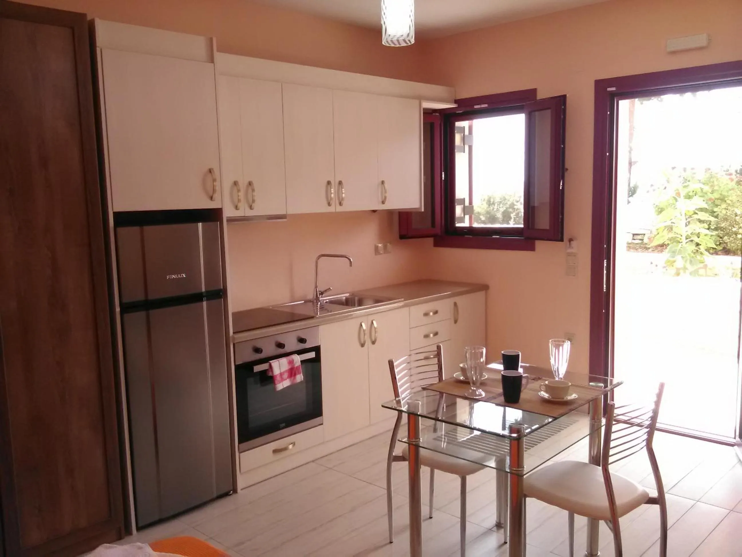 Kitchen or kitchenette in Mikros Gialos Apartments