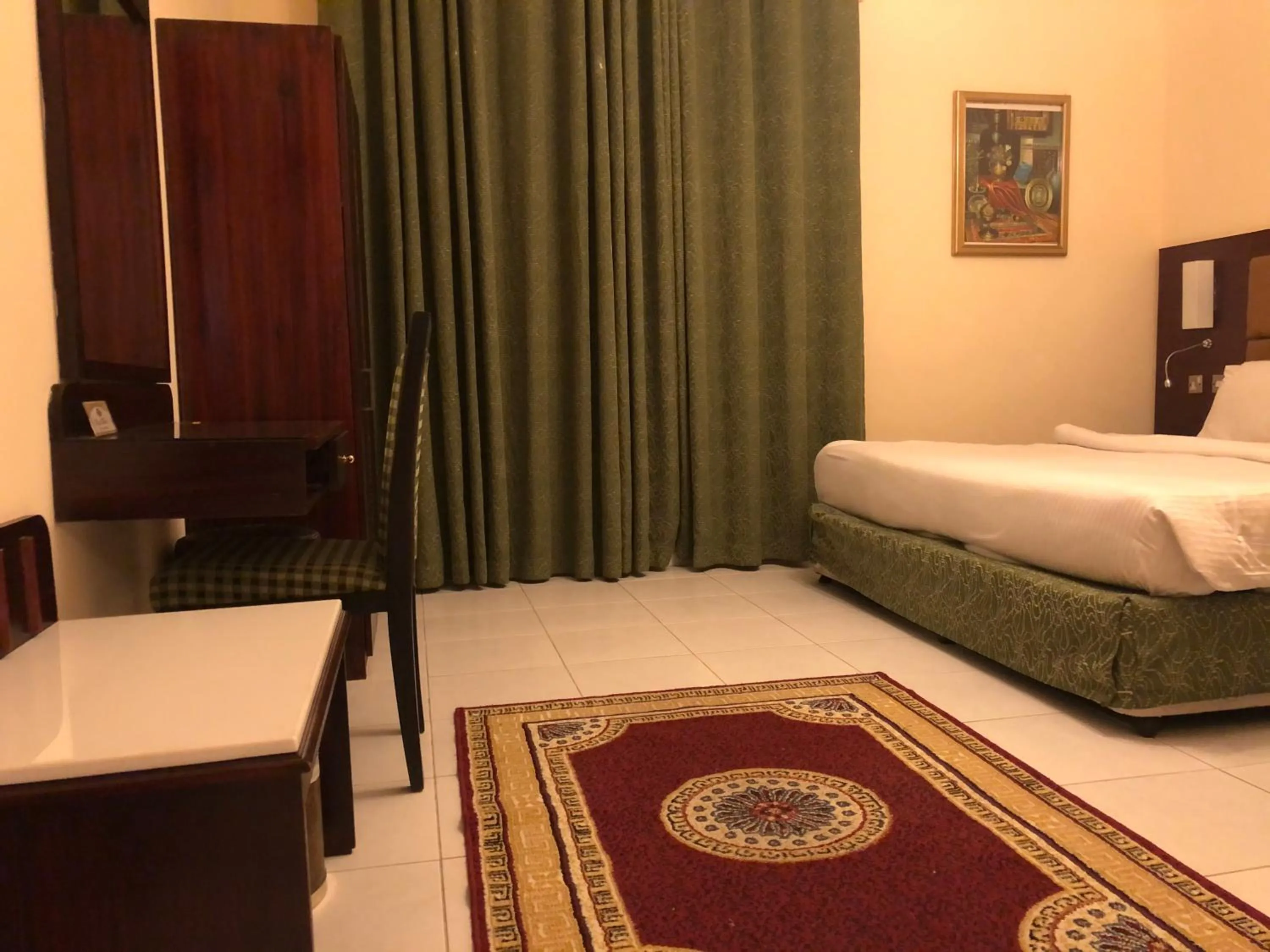 Bed in New Royal Mark Hotel Apartments