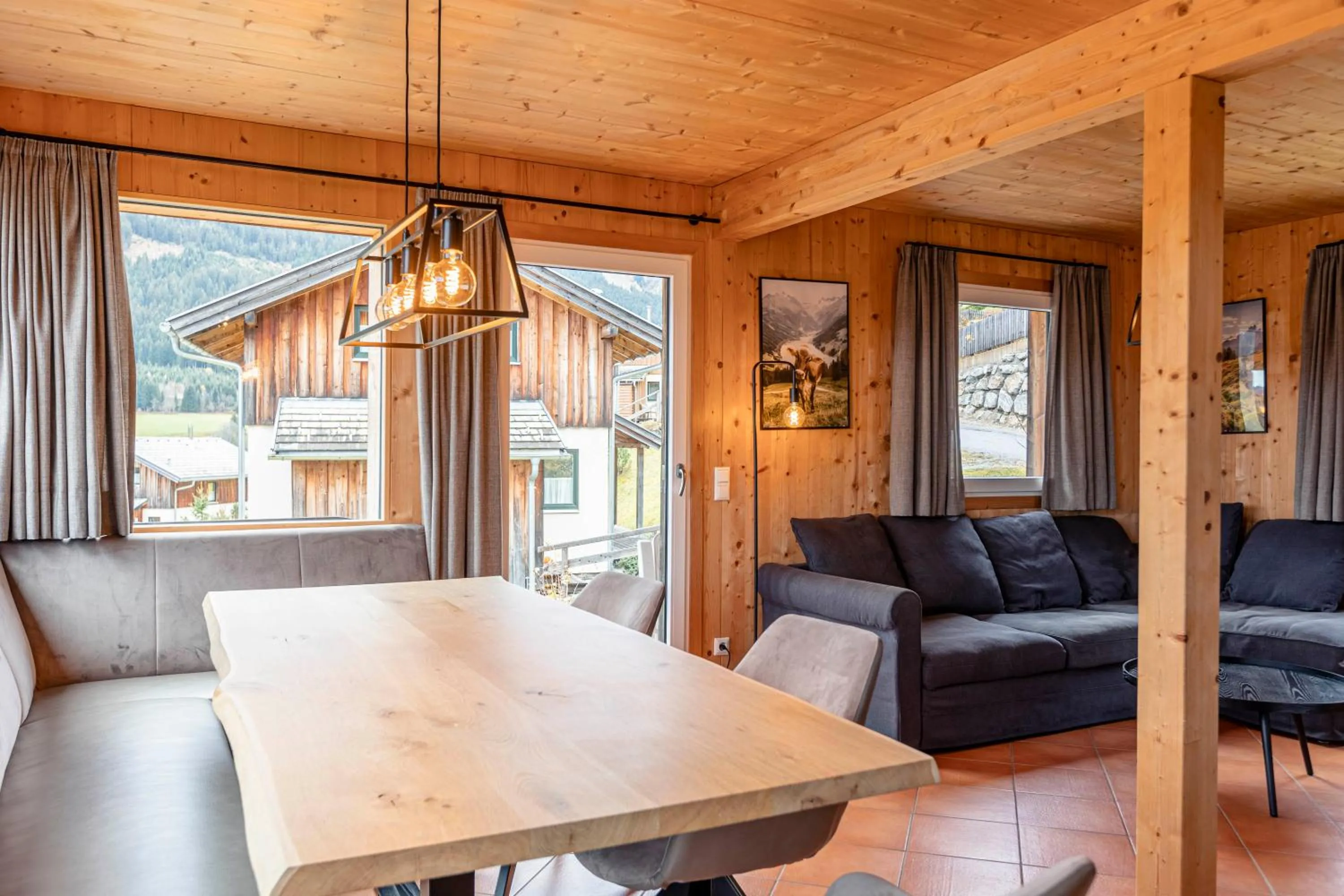 Living room in Alpendorf Dachstein West by ALPS RESORTS