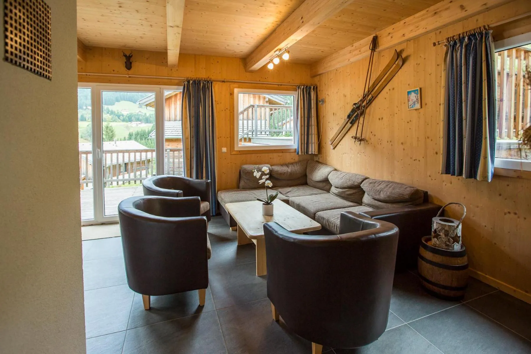 Living room in Alpendorf Dachstein West by ALPS RESORTS