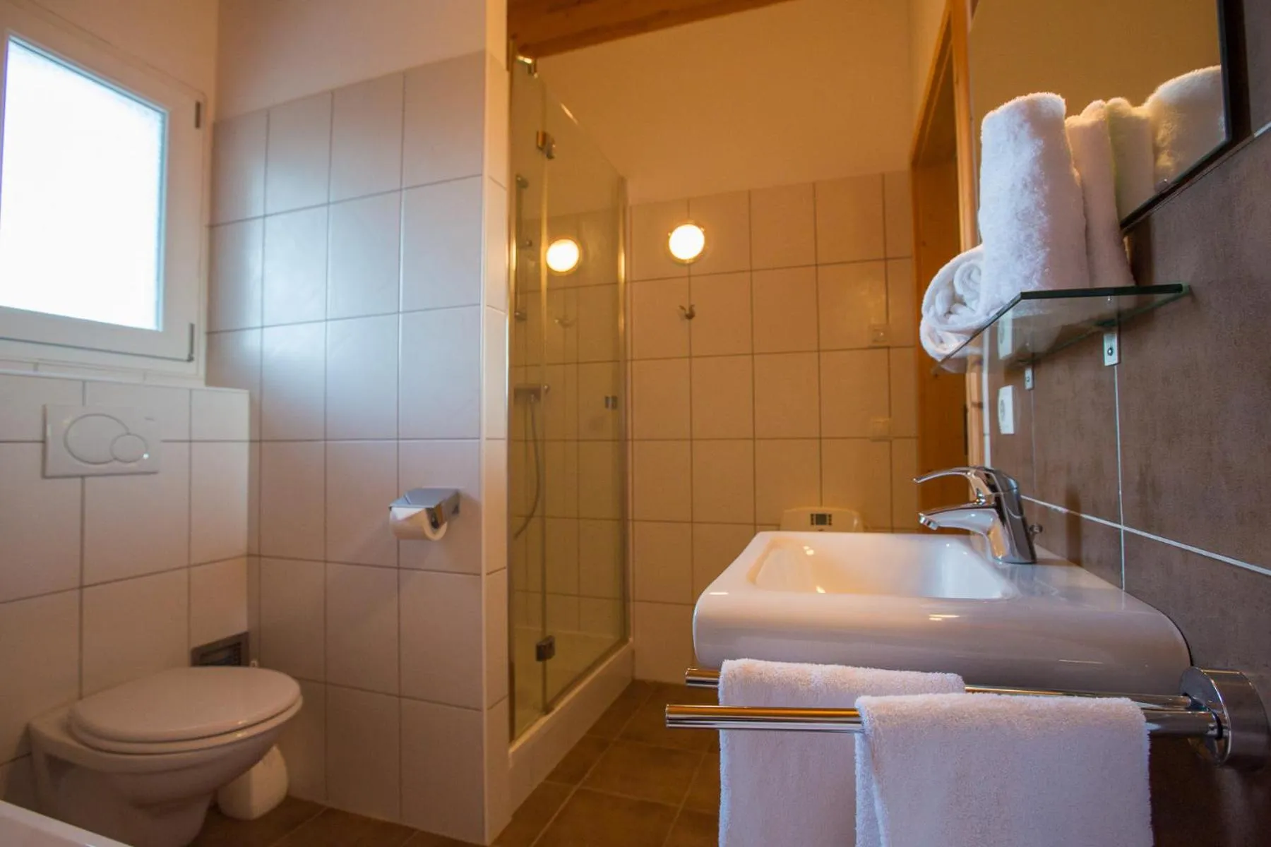 Bathroom in Alpendorf Dachstein West by ALPS RESORTS