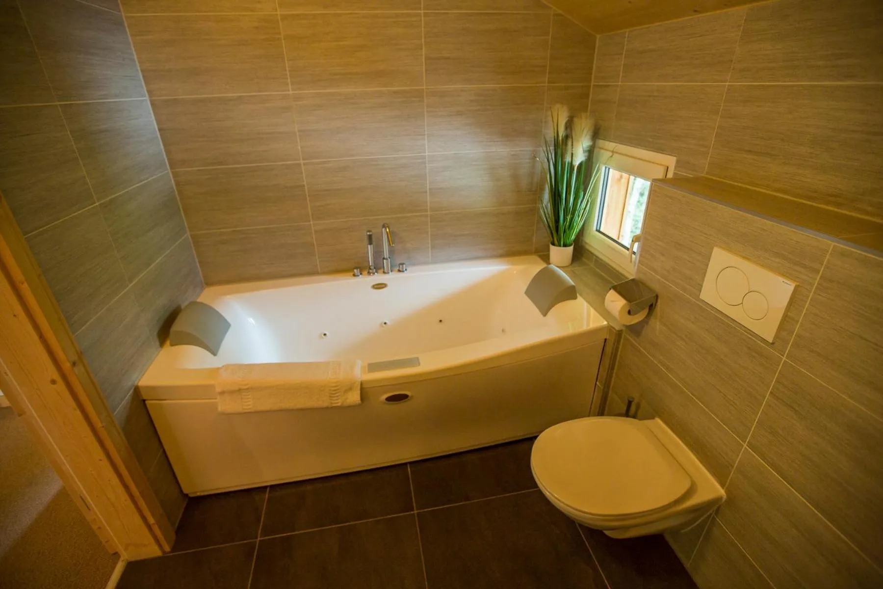Bathroom in Alpendorf Dachstein West by ALPS RESORTS
