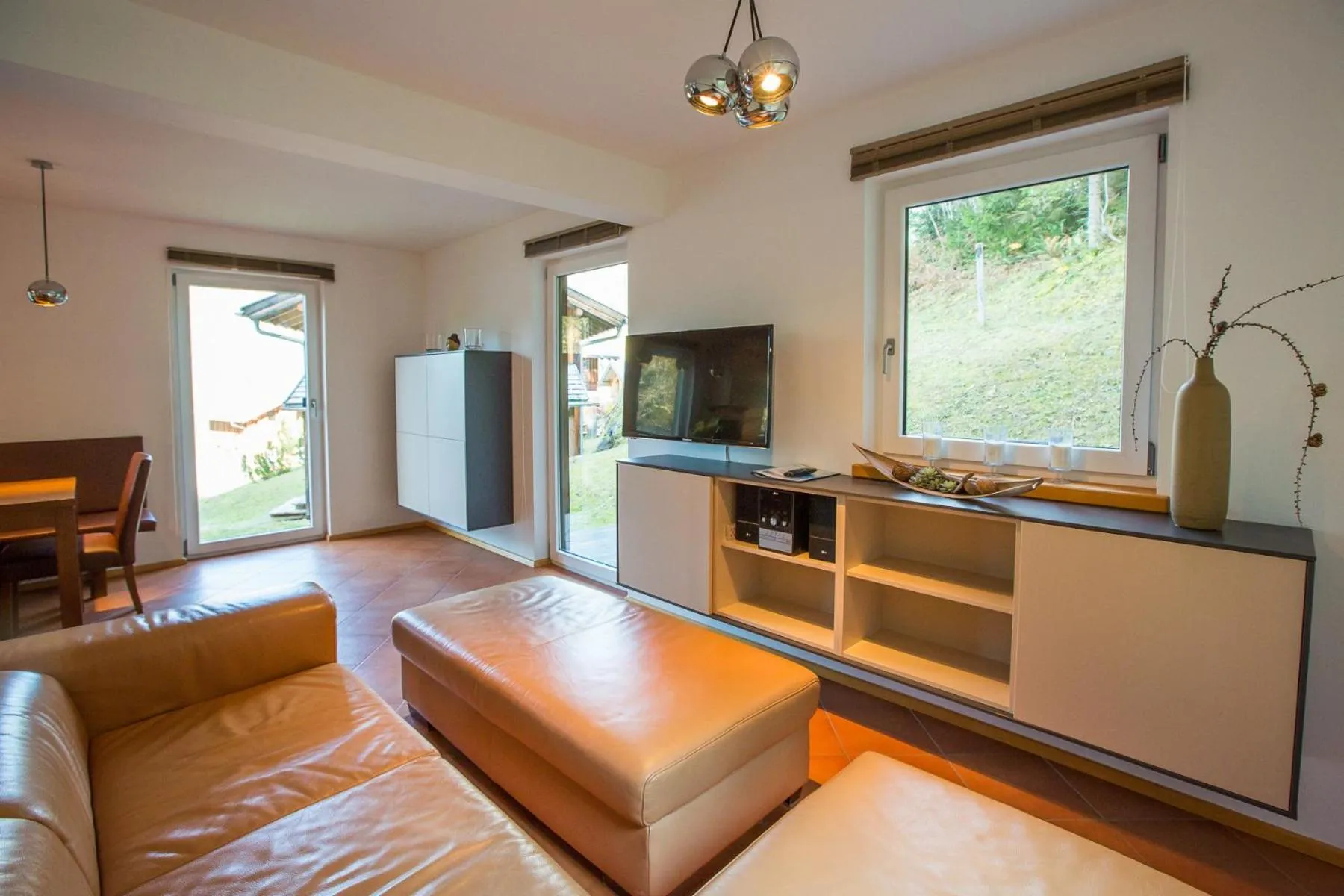 Living room in Alpendorf Dachstein West by ALPS RESORTS