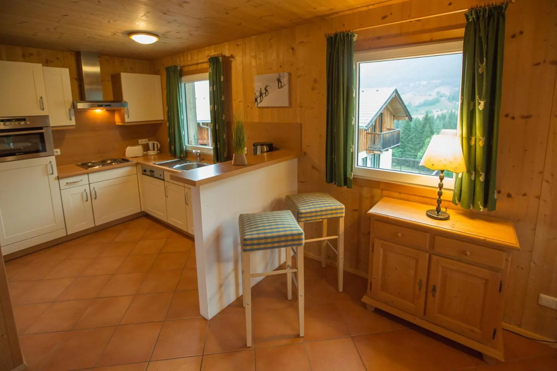 Kitchen or kitchenette in Alpendorf Dachstein West by ALPS RESORTS