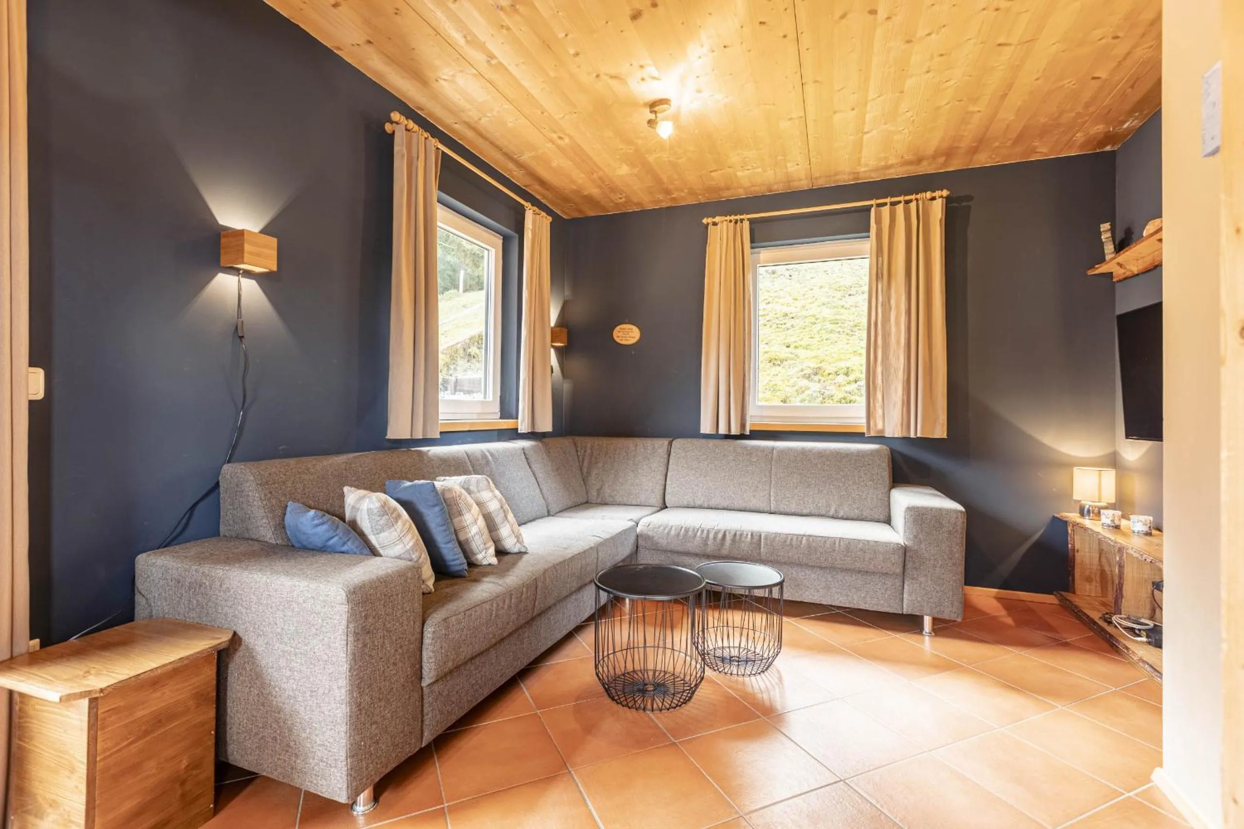 Living room in Alpendorf Dachstein West by ALPS RESORTS