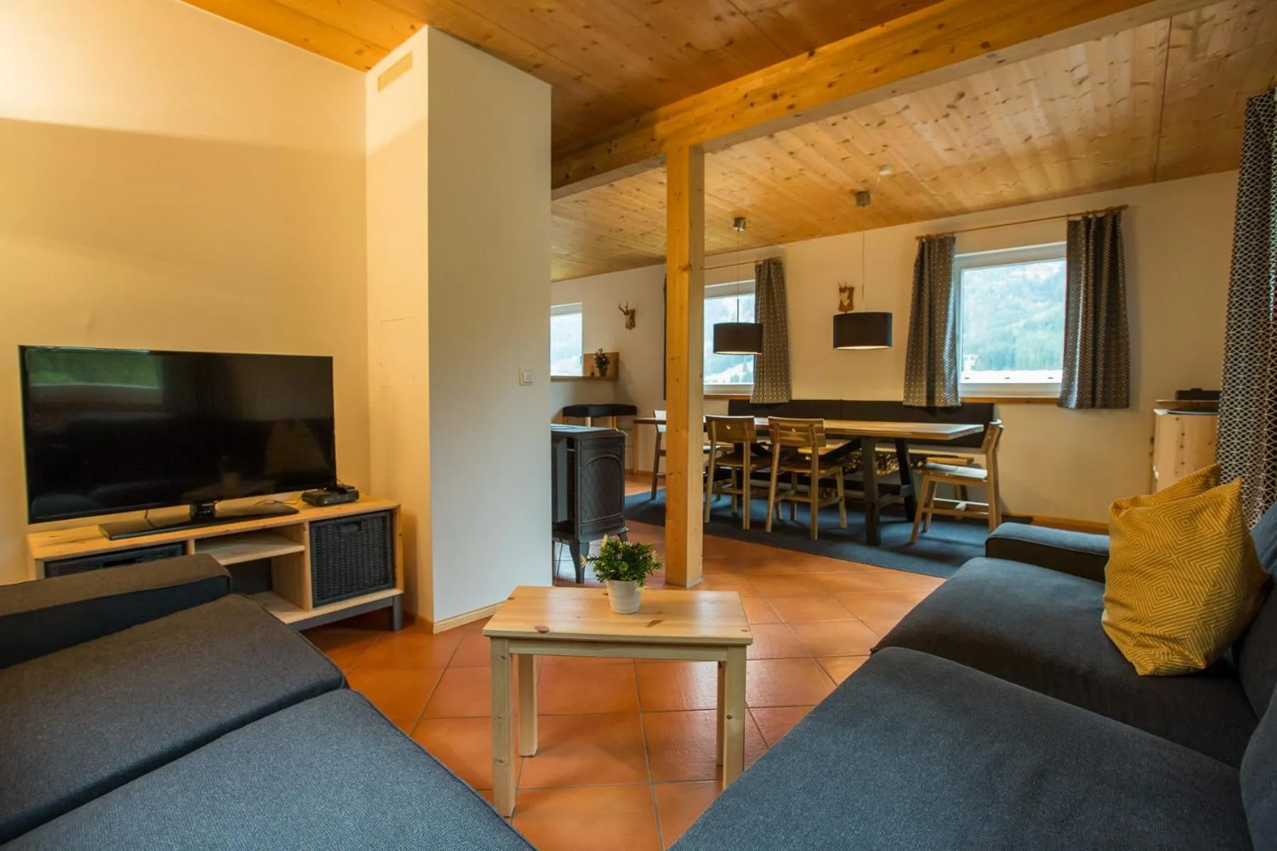 Living room in Alpendorf Dachstein West by ALPS RESORTS