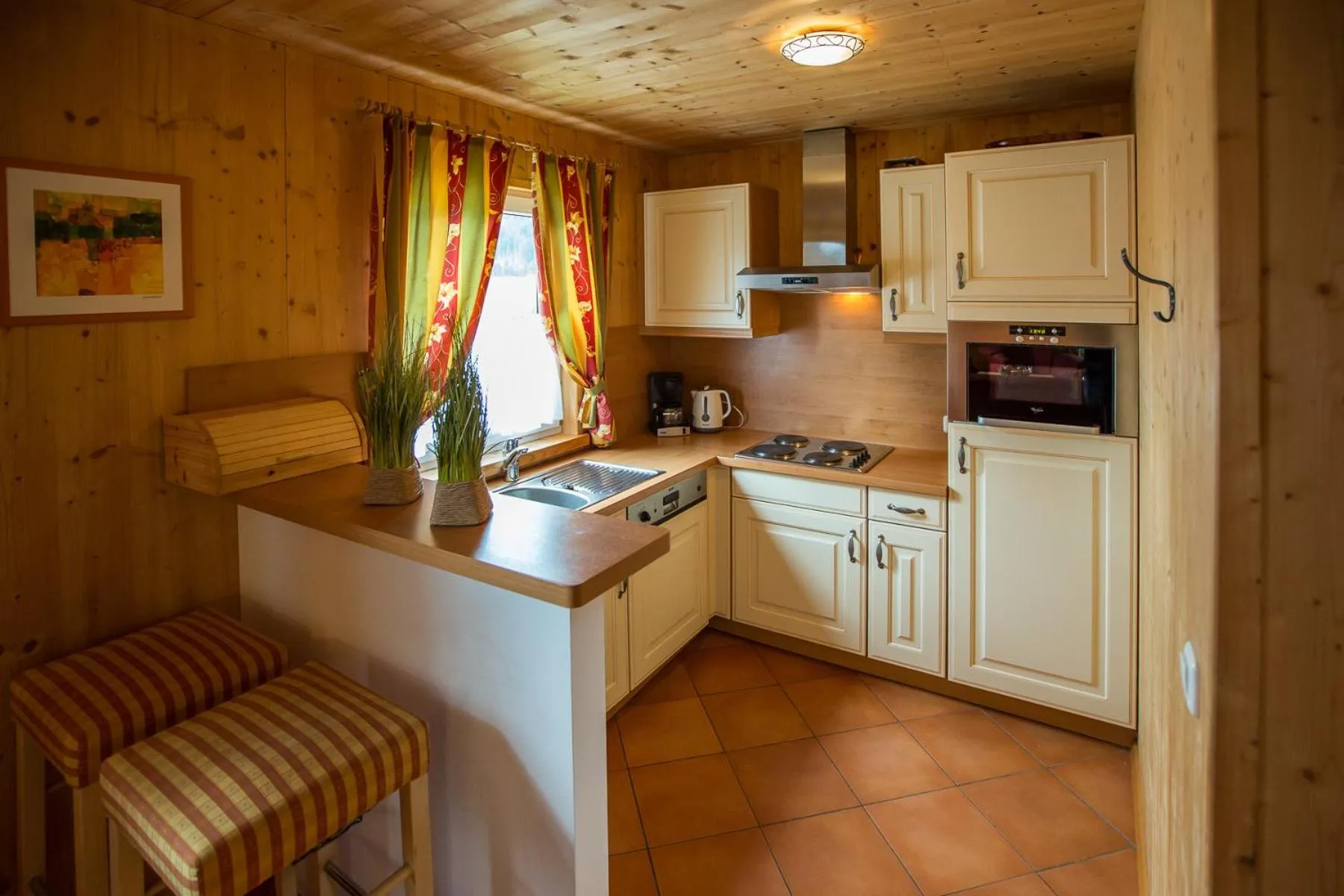 Kitchen or kitchenette in Alpendorf Dachstein West by ALPS RESORTS