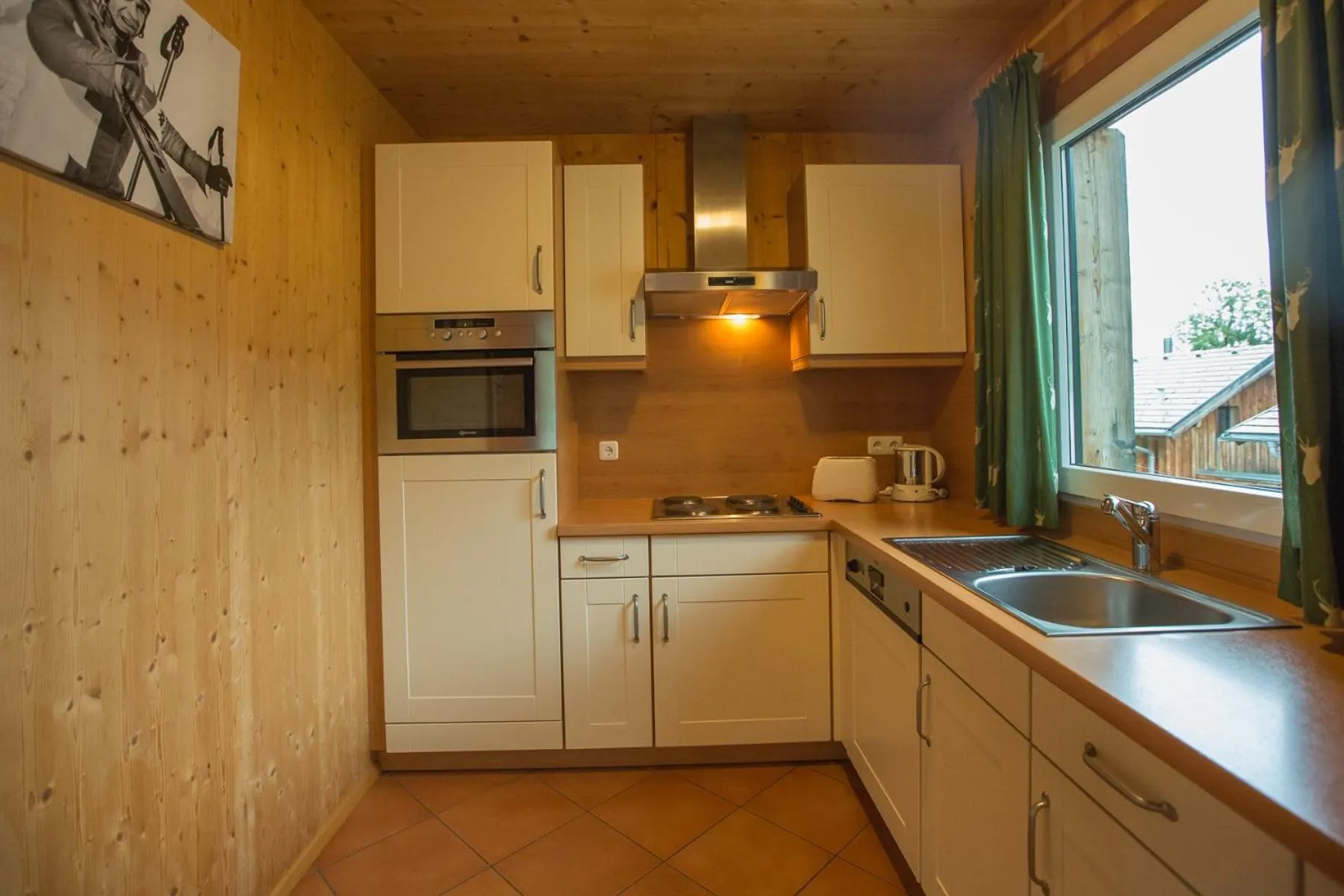 Kitchen or kitchenette in Alpendorf Dachstein West by ALPS RESORTS