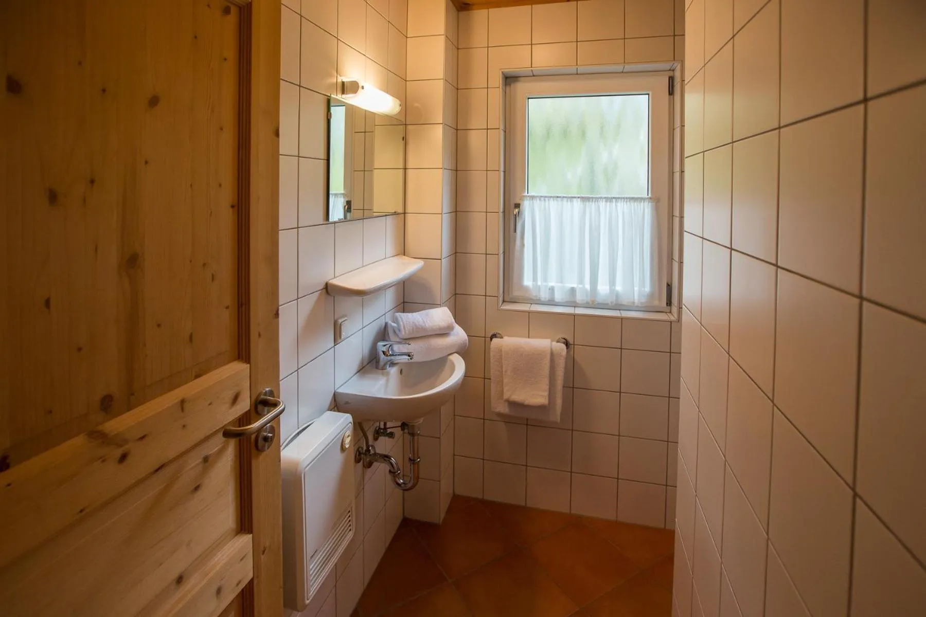 Bathroom in Alpendorf Dachstein West by ALPS RESORTS