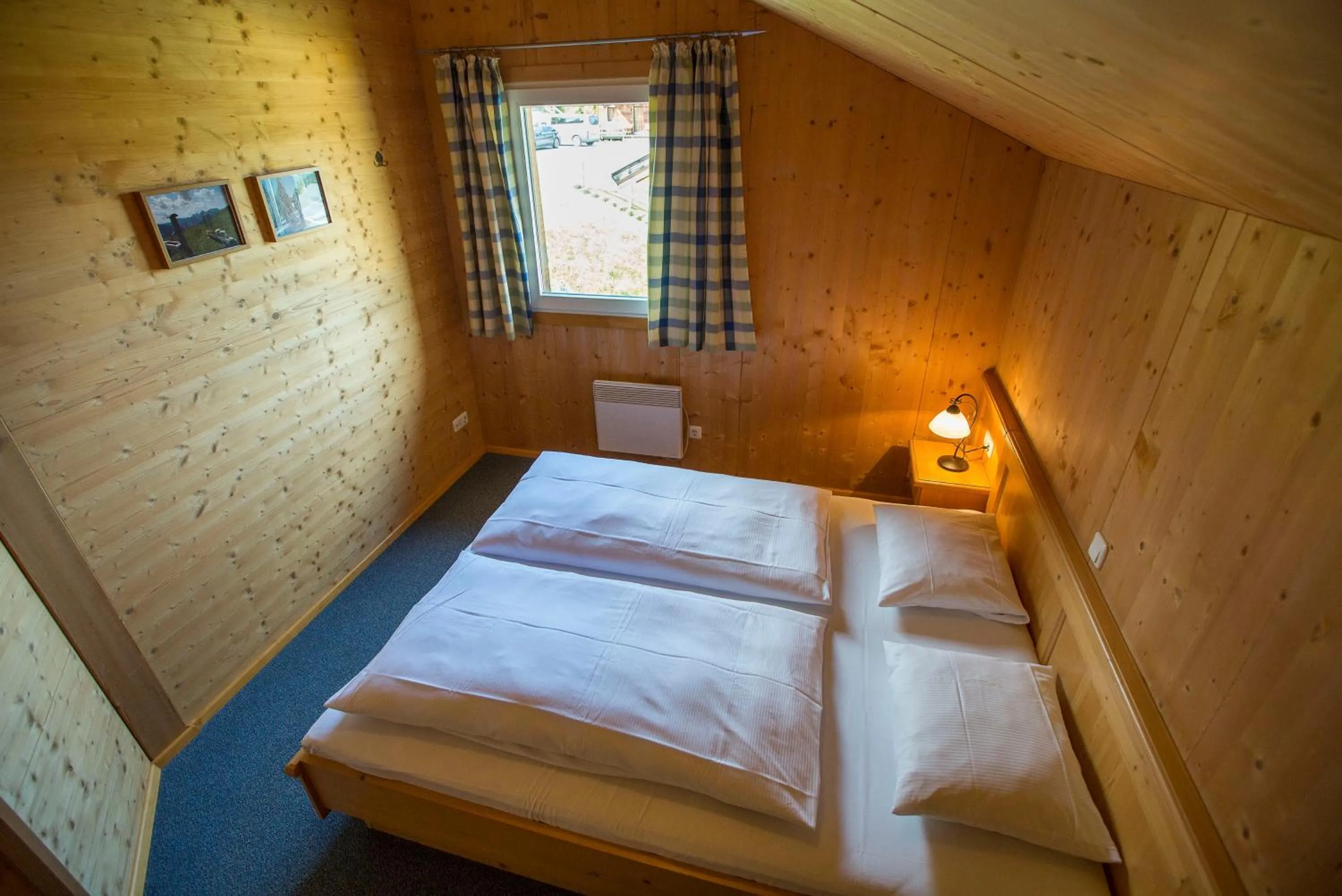 Bedroom, Bed in Alpendorf Dachstein West by ALPS RESORTS