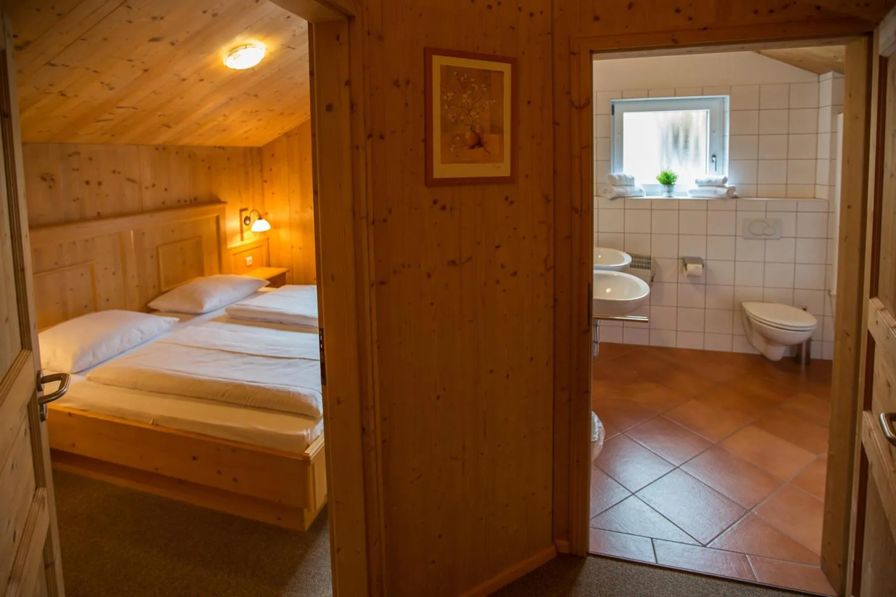 Bathroom, Bed in Alpendorf Dachstein West by ALPS RESORTS
