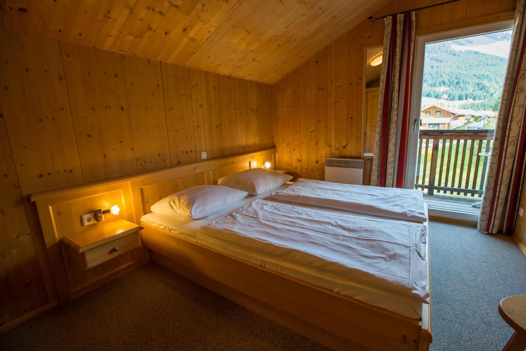 Bedroom, Bed in Alpendorf Dachstein West by ALPS RESORTS