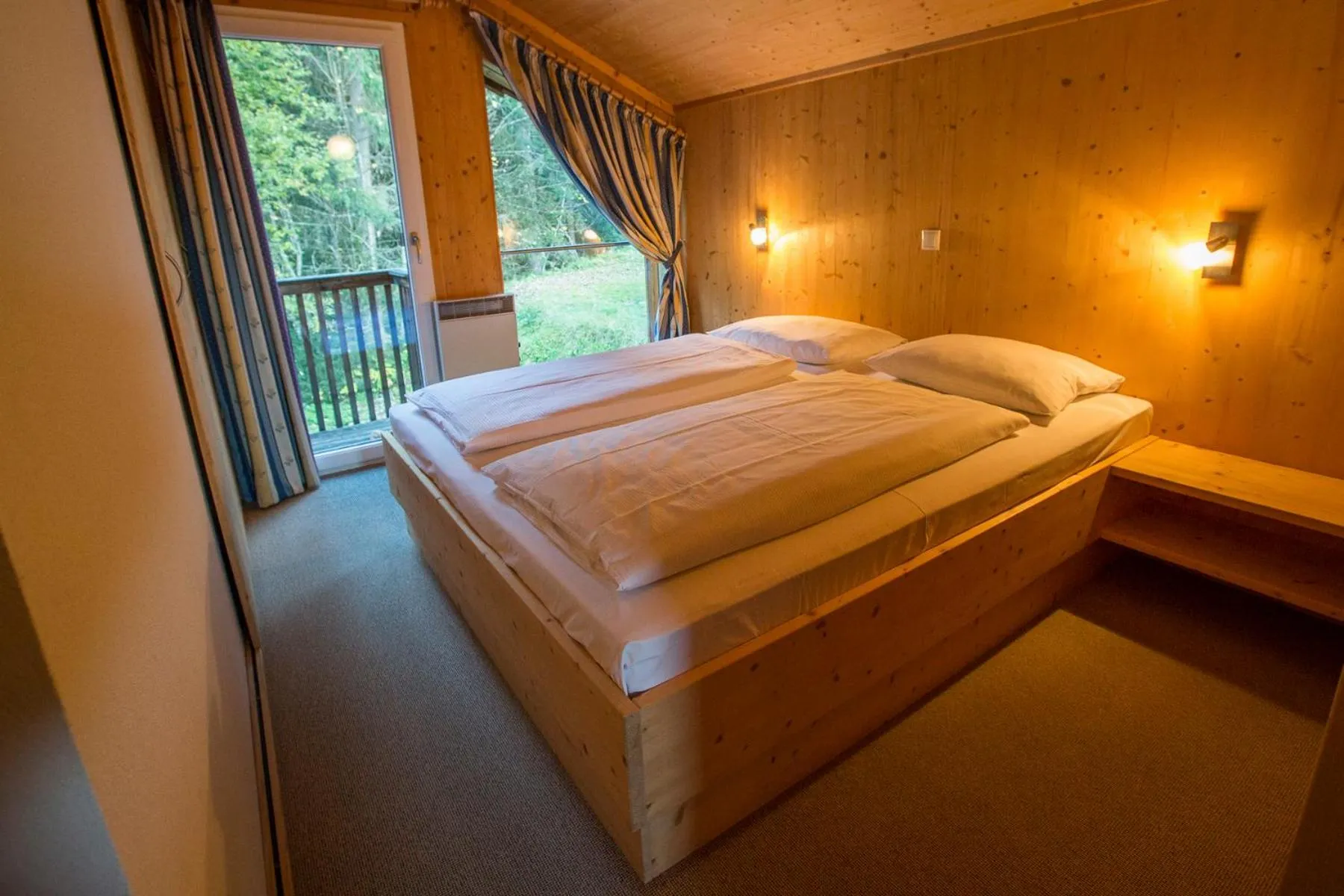 Bedroom, Bed in Alpendorf Dachstein West by ALPS RESORTS