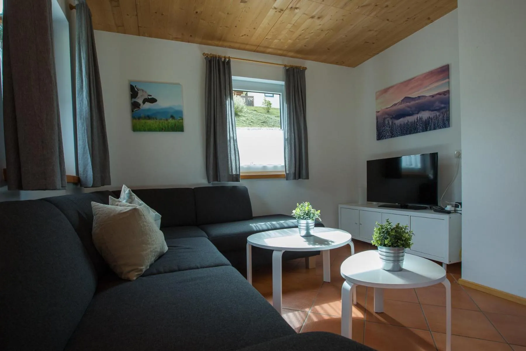 Living room in Alpendorf Dachstein West by ALPS RESORTS