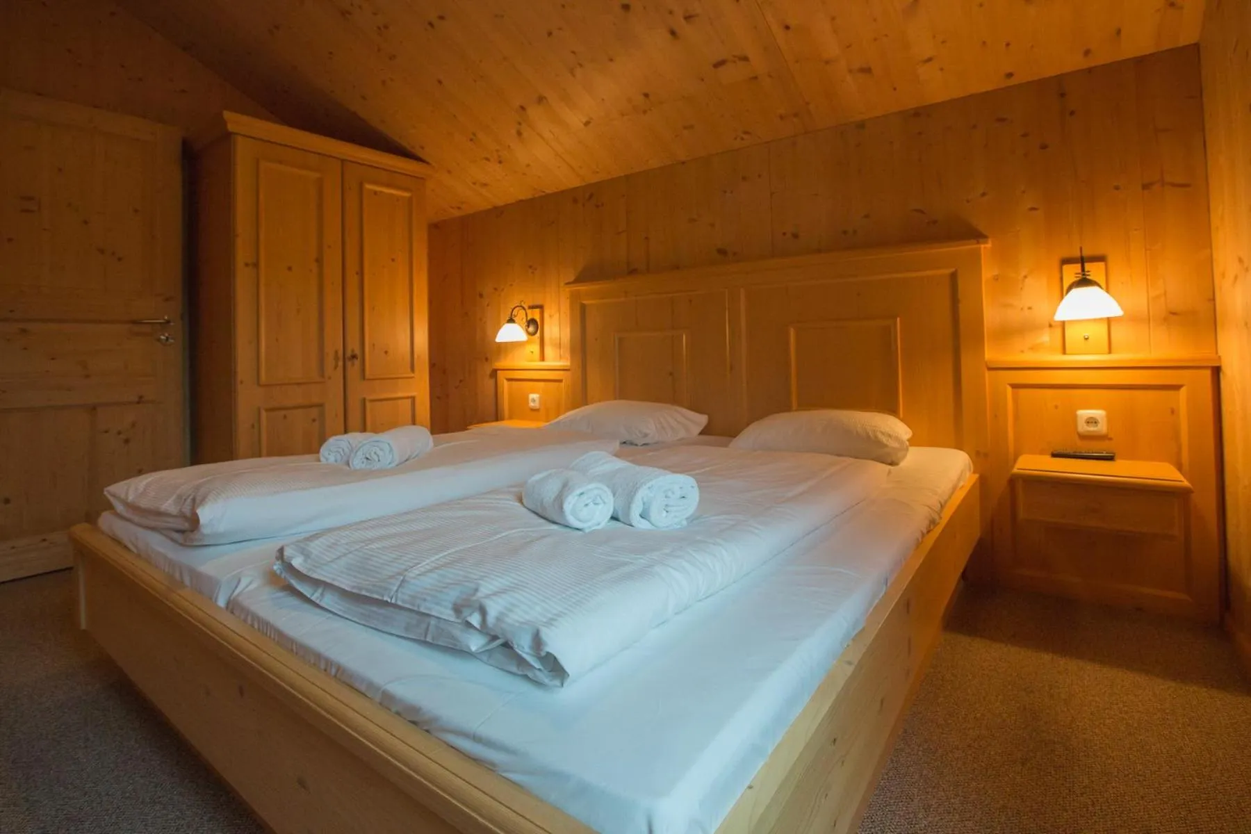 Bedroom, Bed in Alpendorf Dachstein West by ALPS RESORTS