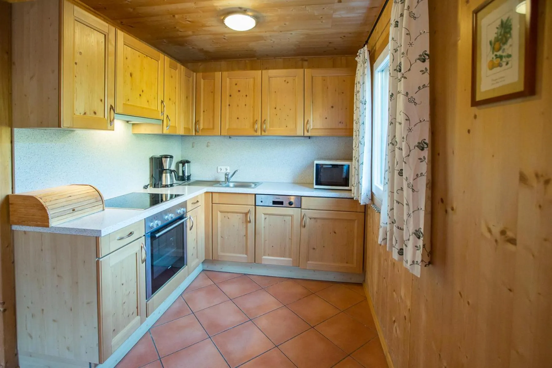 Kitchen or kitchenette in Alpendorf Dachstein West by ALPS RESORTS