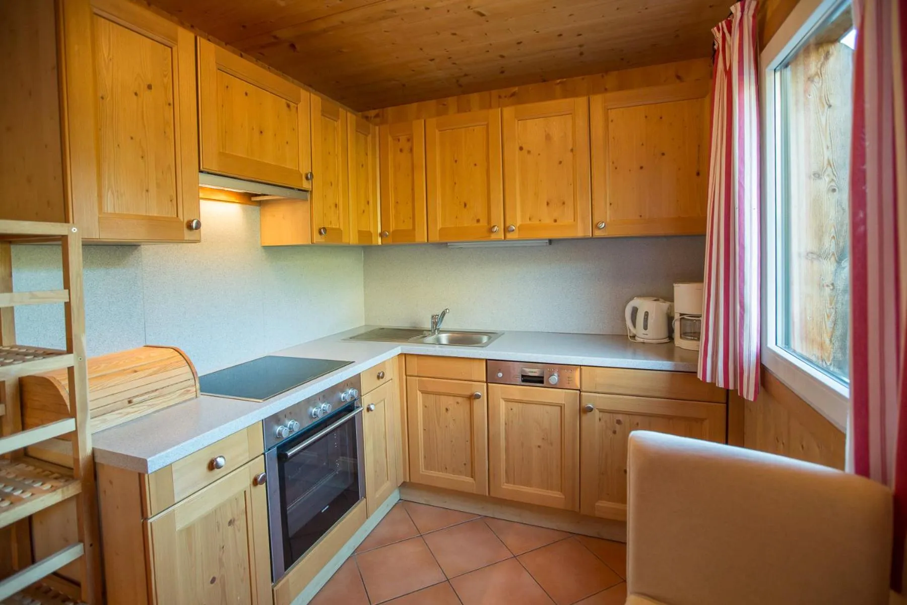 Kitchen or kitchenette in Alpendorf Dachstein West by ALPS RESORTS