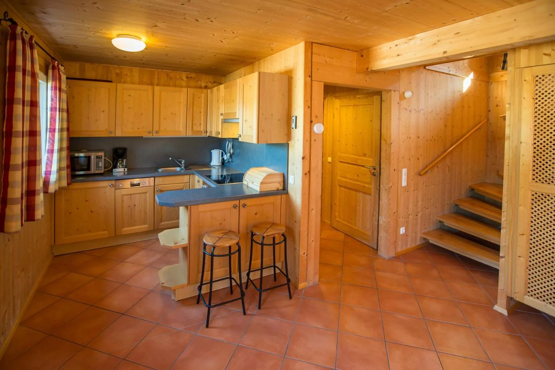 kitchen in Alpendorf Dachstein West by ALPS RESORTS