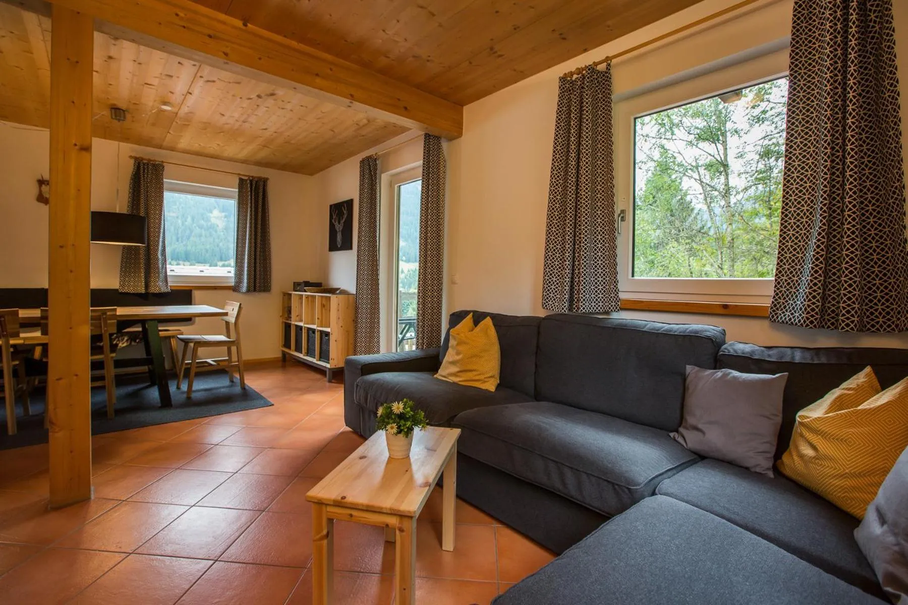 Living room in Alpendorf Dachstein West by ALPS RESORTS
