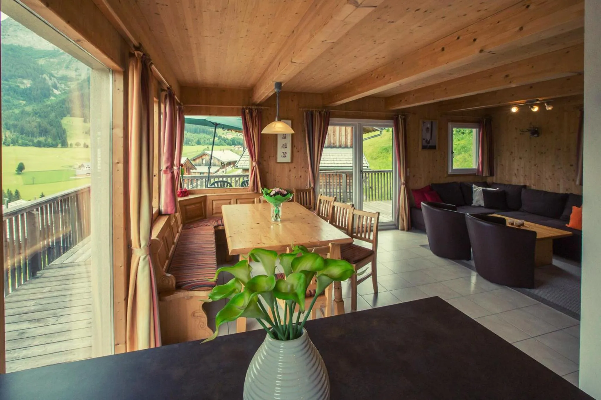 Living room in Alpendorf Dachstein West by ALPS RESORTS