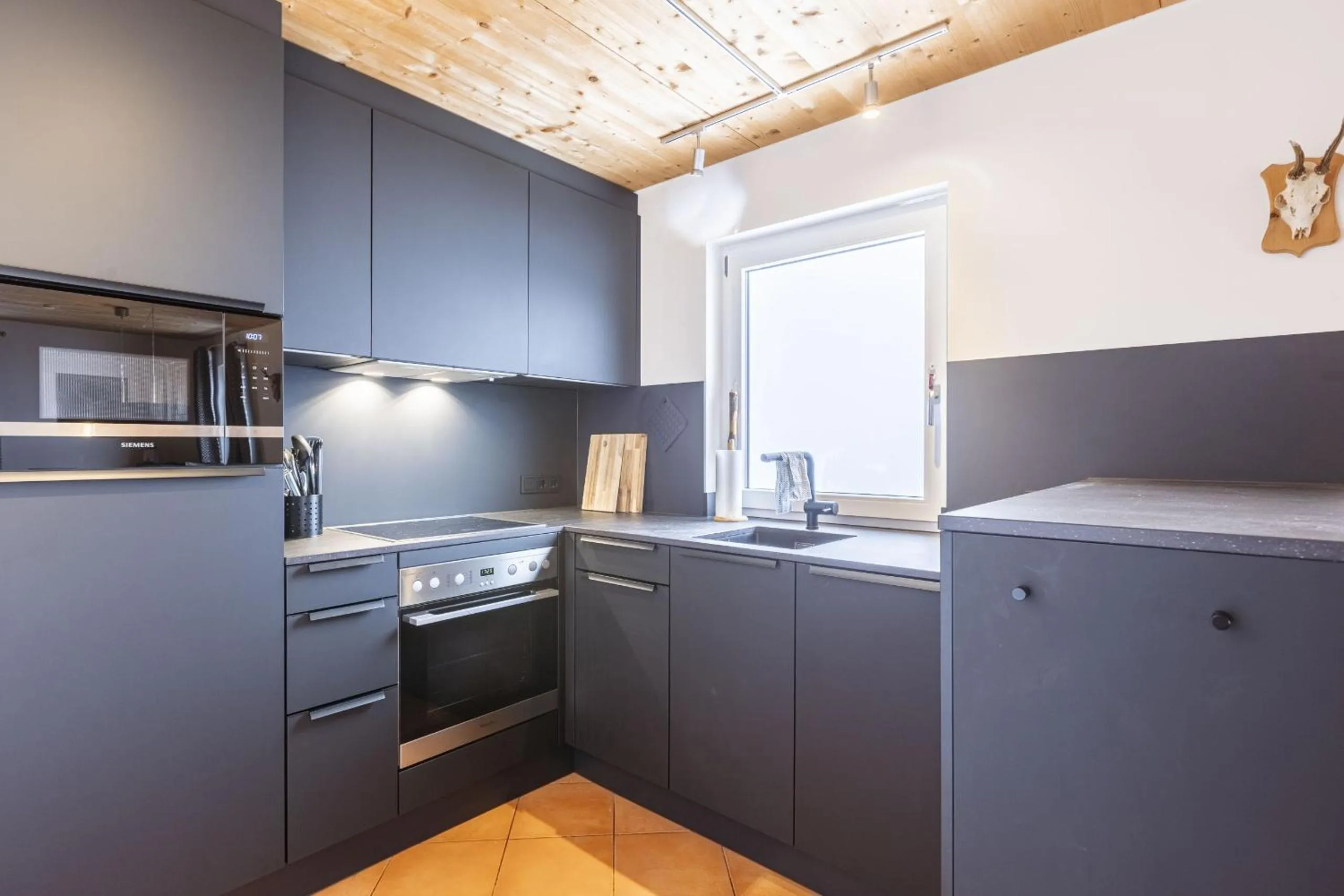 Kitchen or kitchenette in Alpendorf Dachstein West by ALPS RESORTS