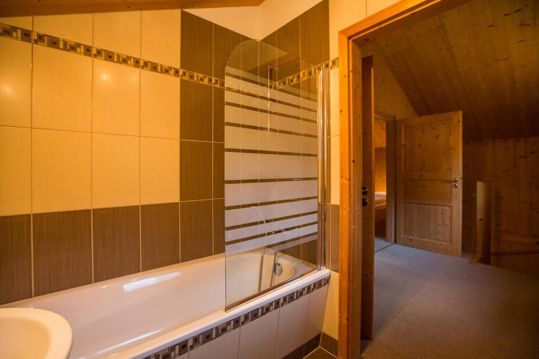 Bathroom in Alpendorf Dachstein West by ALPS RESORTS