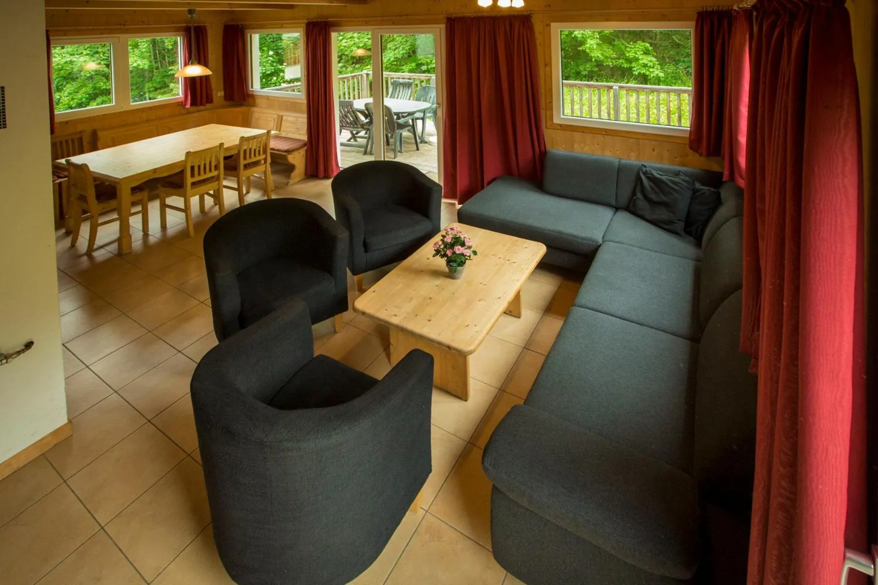 Living room in Alpendorf Dachstein West by ALPS RESORTS