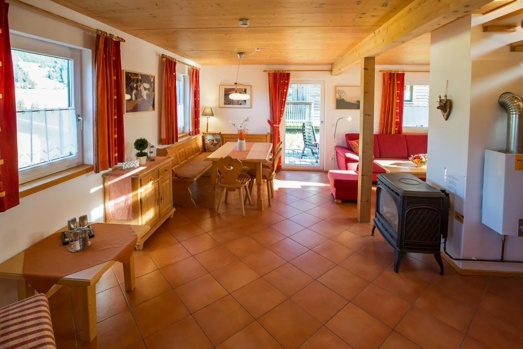 Living room in Alpendorf Dachstein West by ALPS RESORTS