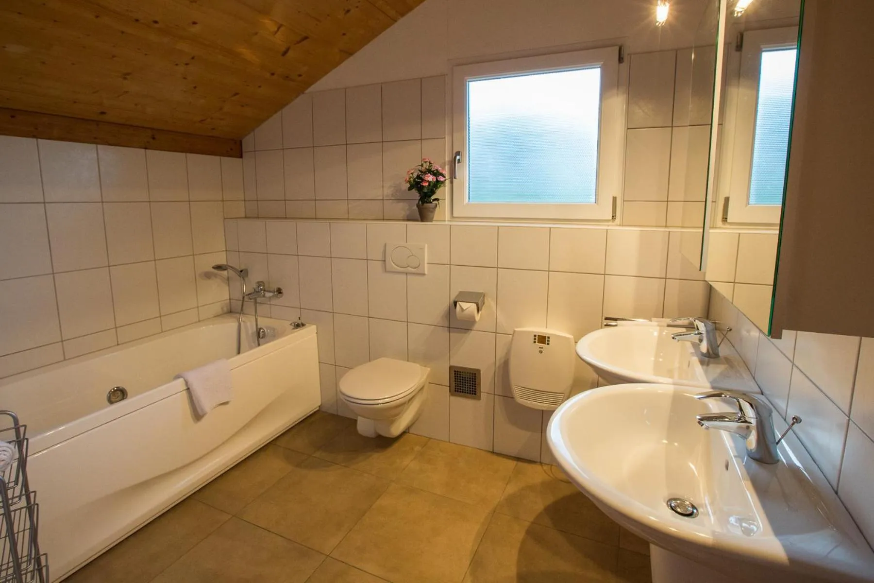 Bathroom in Alpendorf Dachstein West by ALPS RESORTS